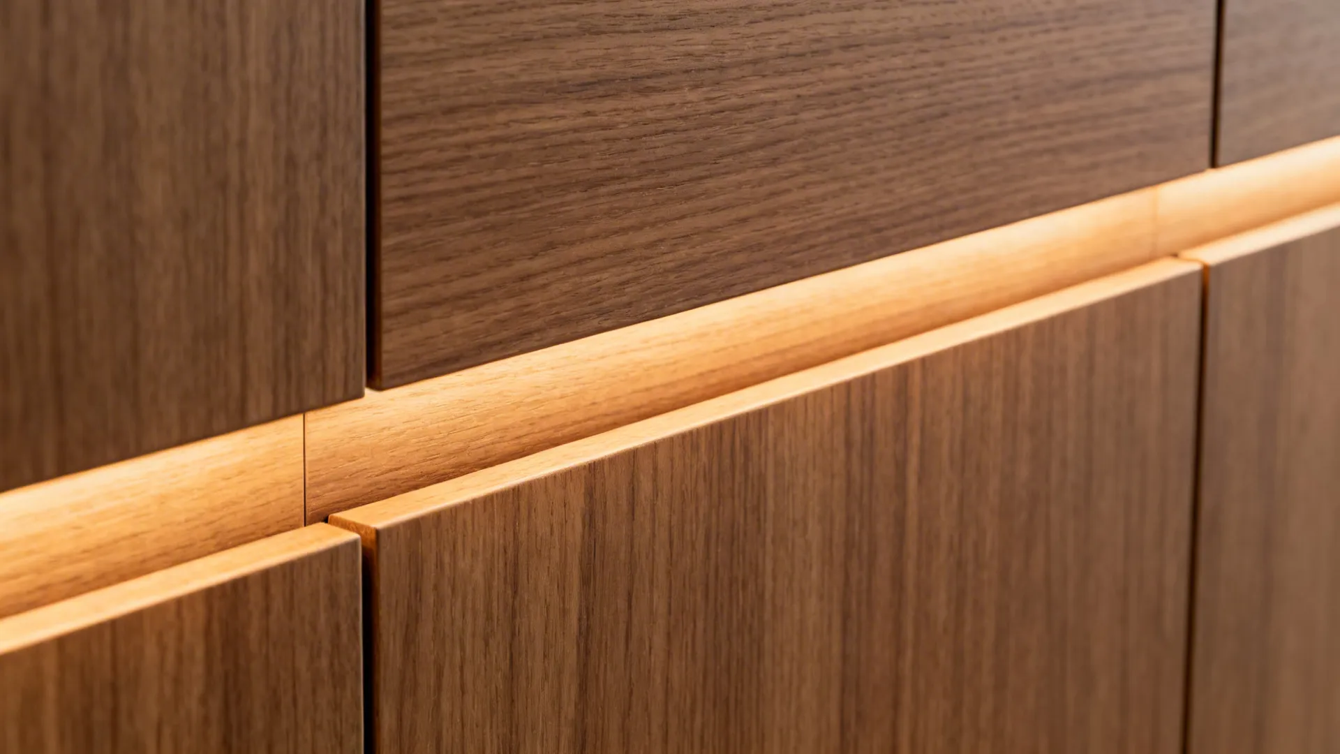 Close up of dark wood cabinet doors featuring hidden warm light strips between the horizontal panels