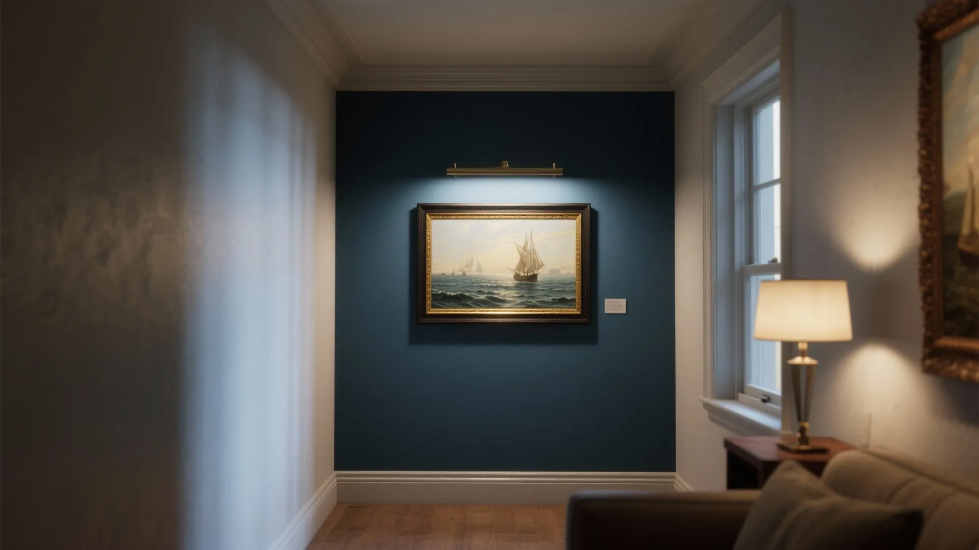 Small display corner with a framed maritime seascape lit by a gallery-style directional light and protected by glazing.