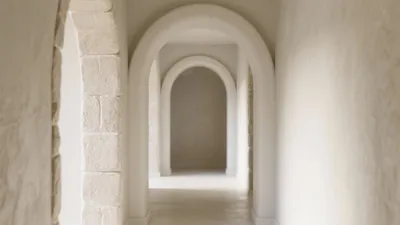 Serene Arched Hallway Design with Textured Walls