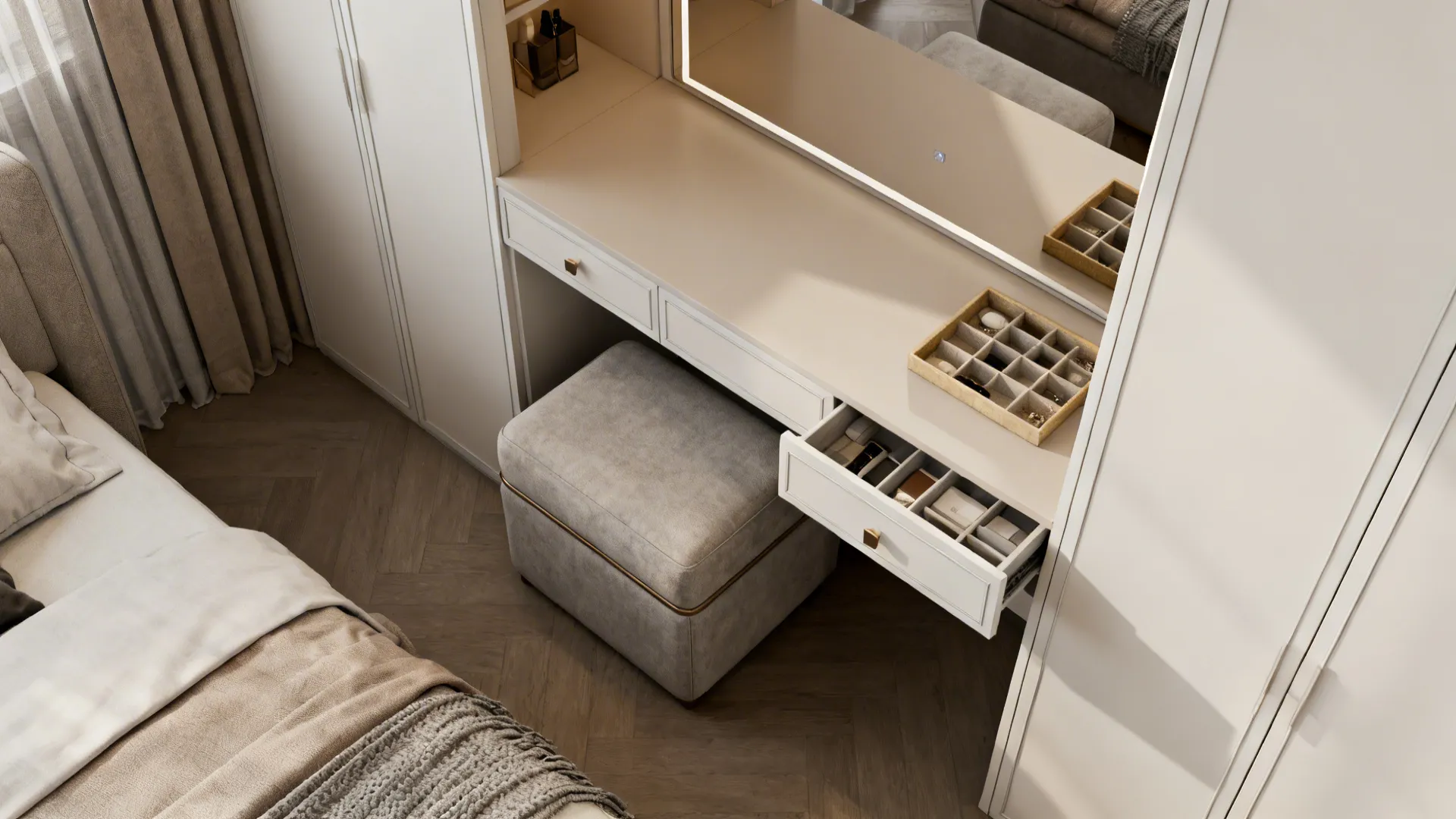 Top-down view of a dressing desk with an upholstered bench doubling as seating in a bedroom.