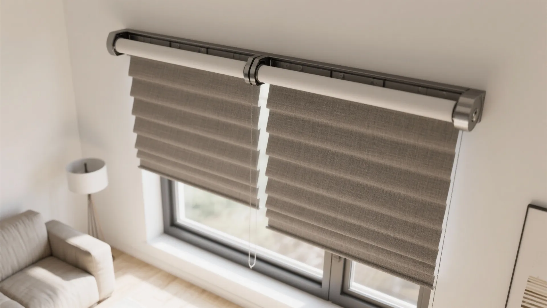 Modern grey window curtains hanging in a bright living room next to a white sofa