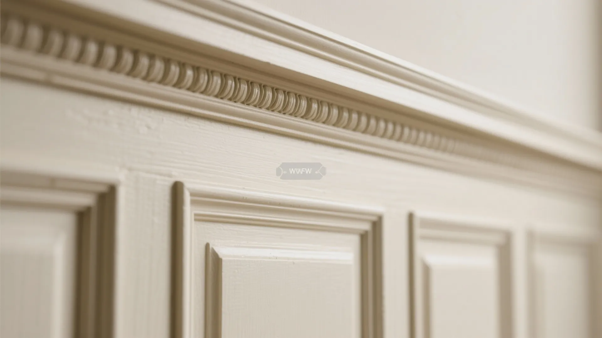 Detailed Edwardian moulding and wainscoting in cream tones