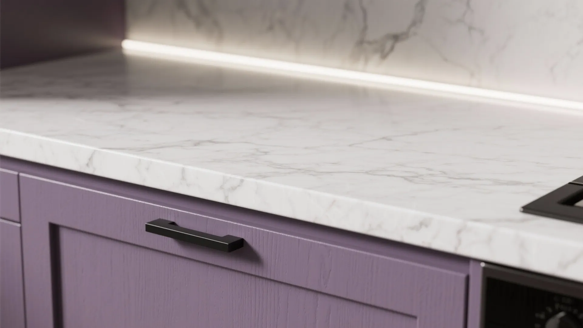 White marble kitchen counter with black handle on purple wood drawer and warm hidden light fixture