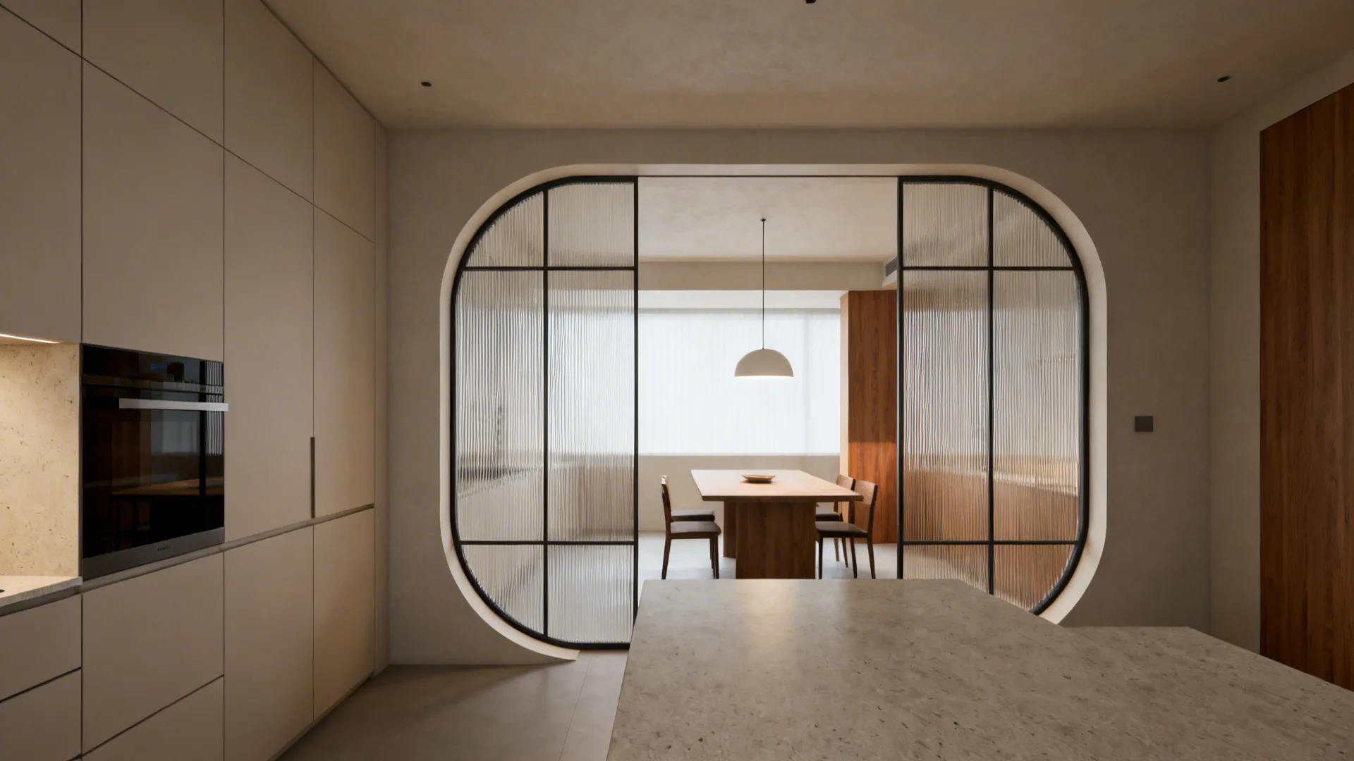A shallow elliptical plaster arch with reeded glass screens softly separates a minimalist kitchen and dining room.