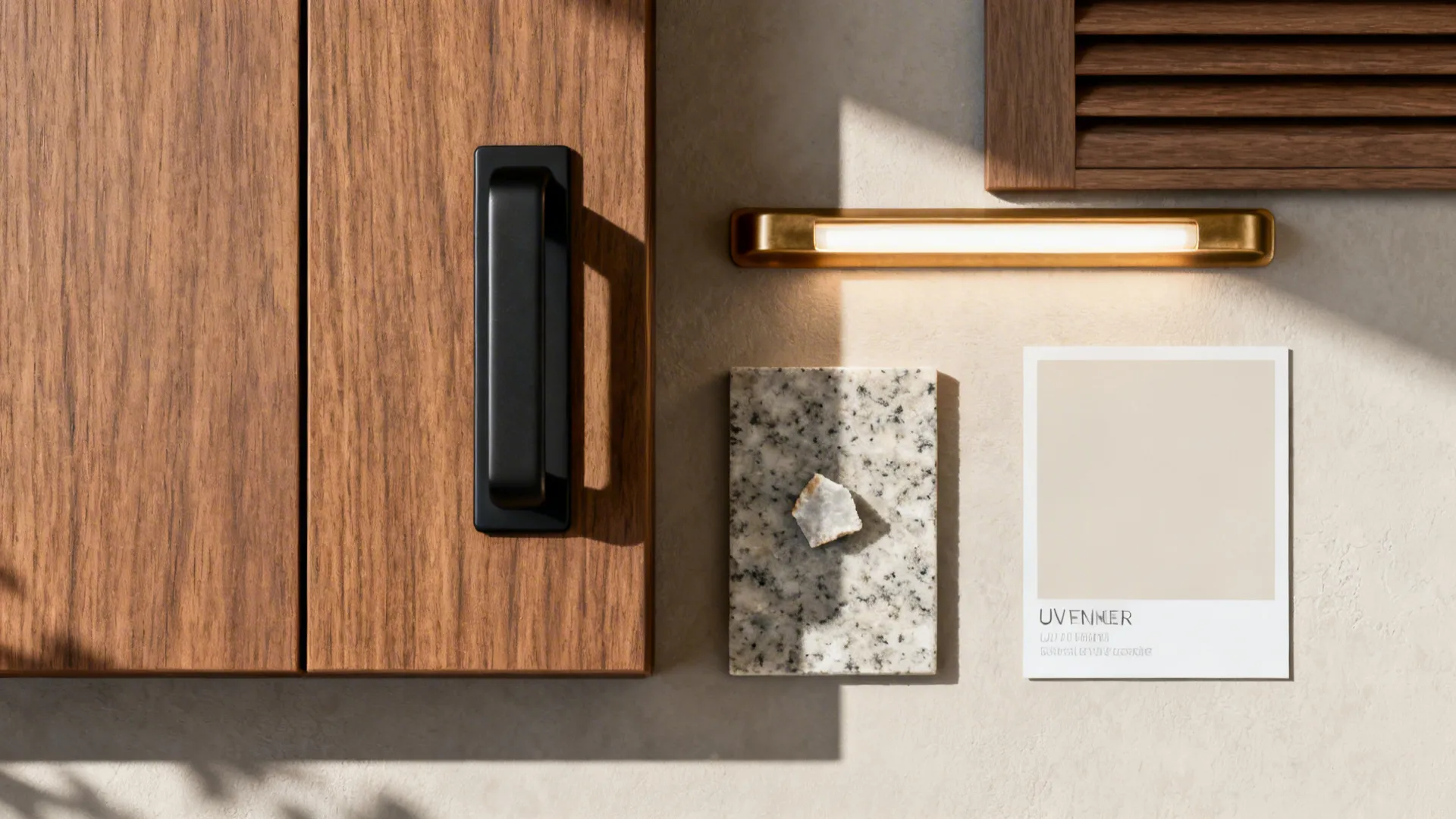 Flat lay of teak laminate, matte black hardware, quartz, brass, LED diffuser, and neutral paint.