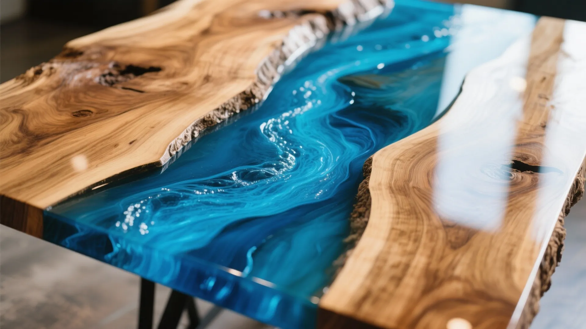 Close up of a wooden table featuring a blue liquid design and natural wood grain