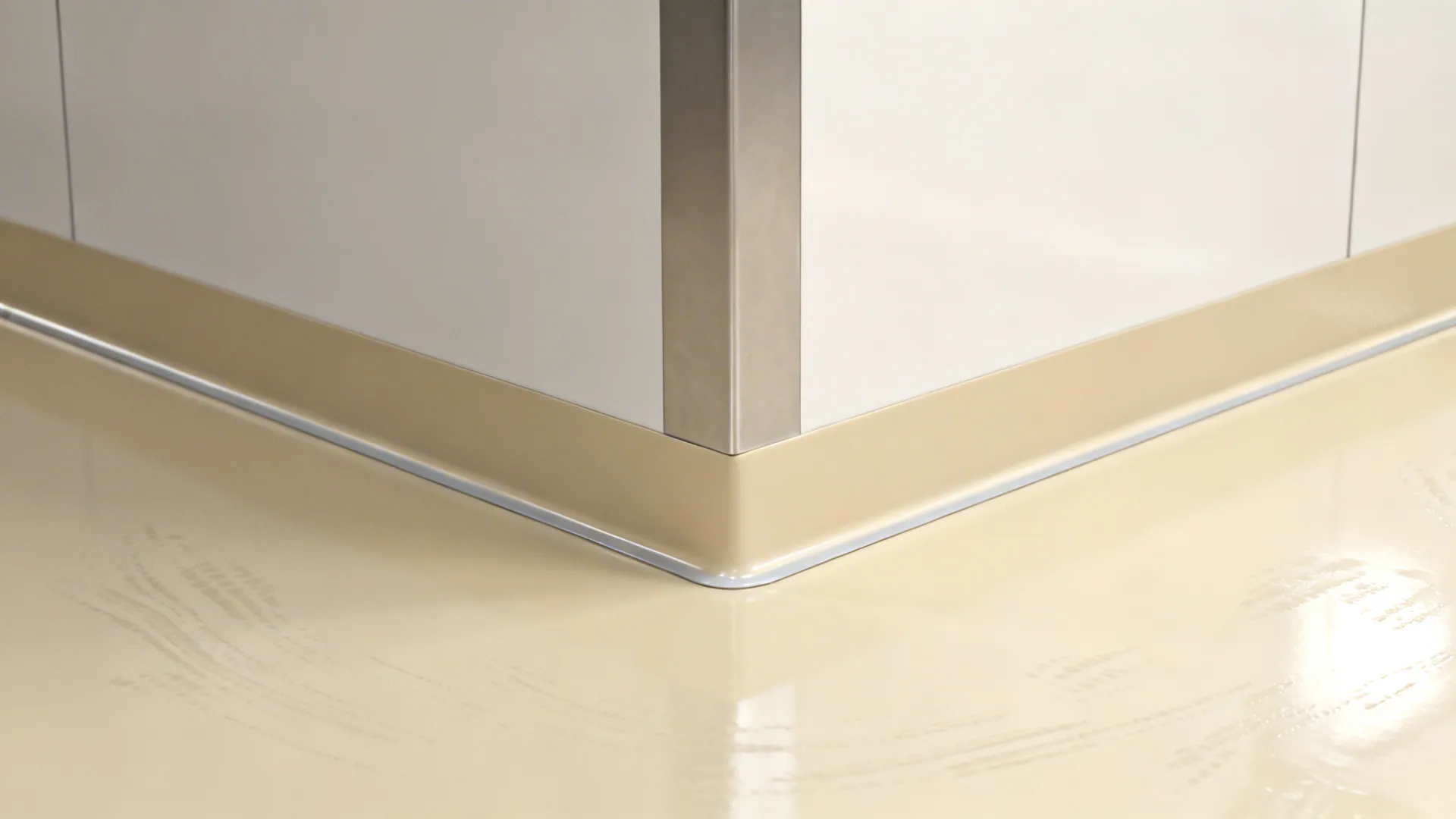 Close up of white wall corner with beige curved wall panel and shiny clean floor