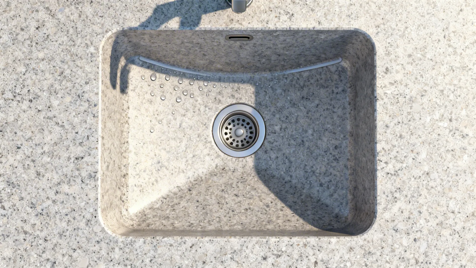 Top-down view showing sink setback, gentle slope to drain, rounded corners, and offset drain in a granite counter.