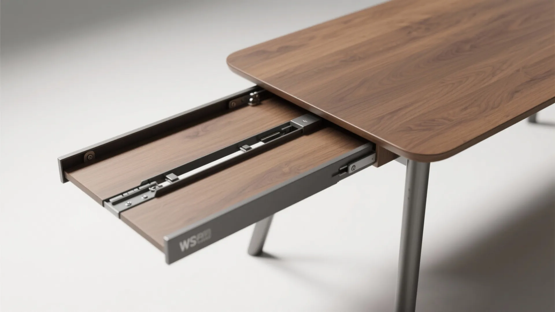 Close up of a wooden extendable dining table showing the metal sliding mechanism for expansion