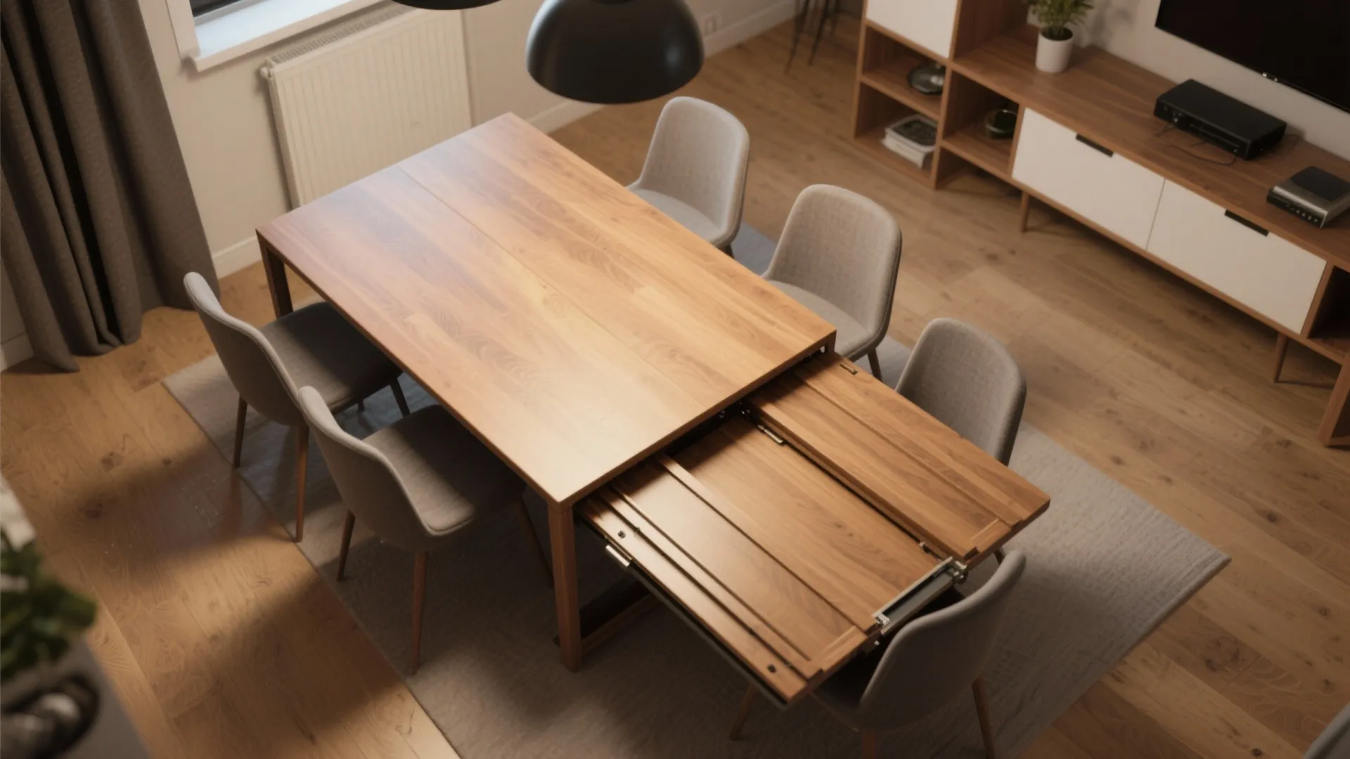 Modern wooden dining table with an extension leaf shown partially open in a bright room