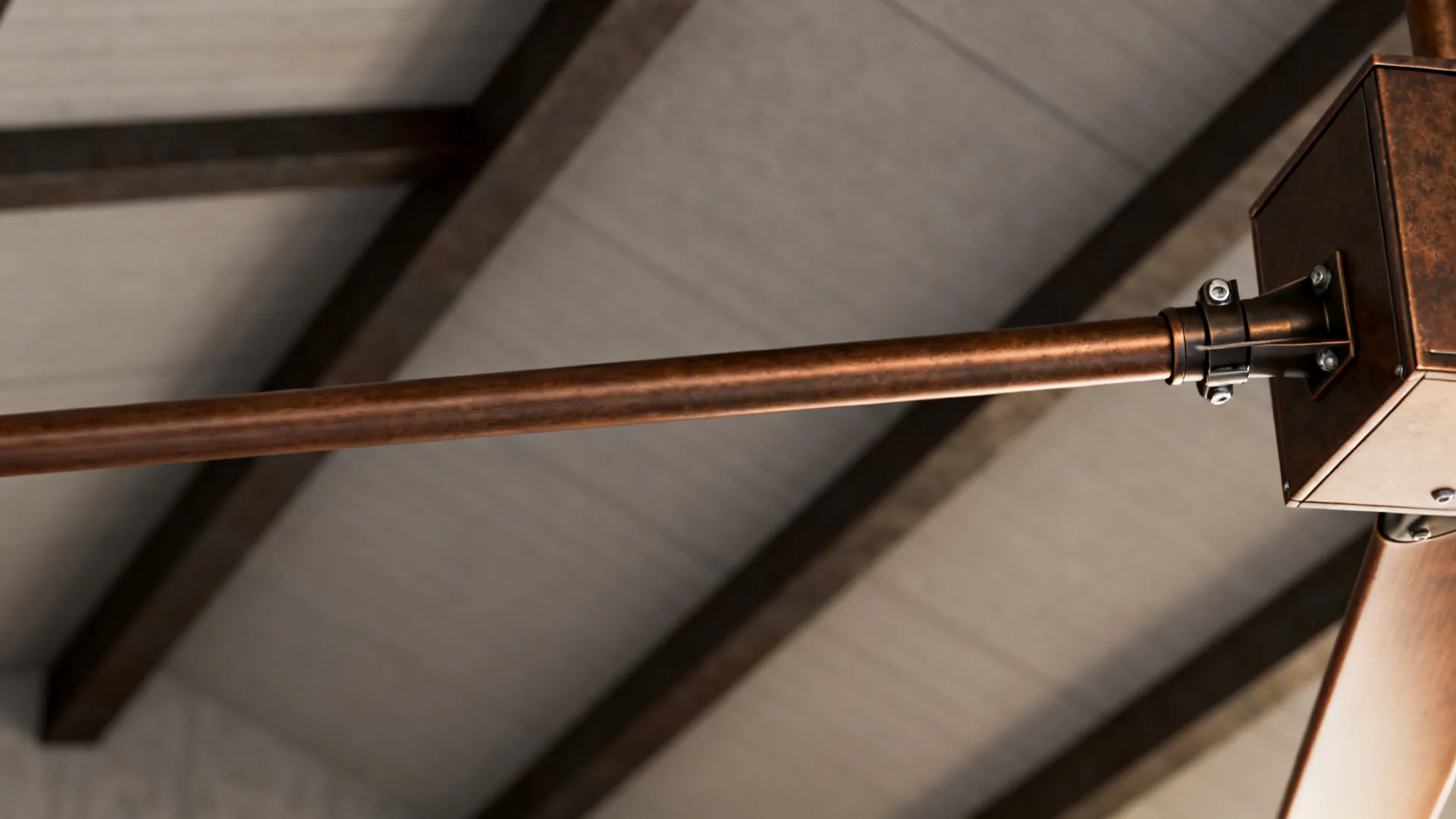 Close-up of an extended downrod and secure mounting on a vaulted ceiling with exposed beams.