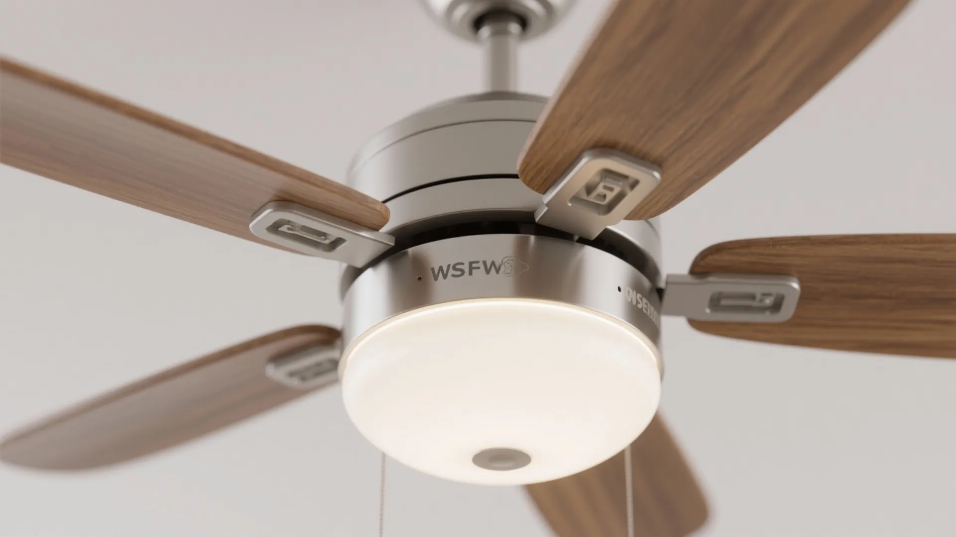 Close up view of a ceiling fan with light fixture and dark wood blades design details