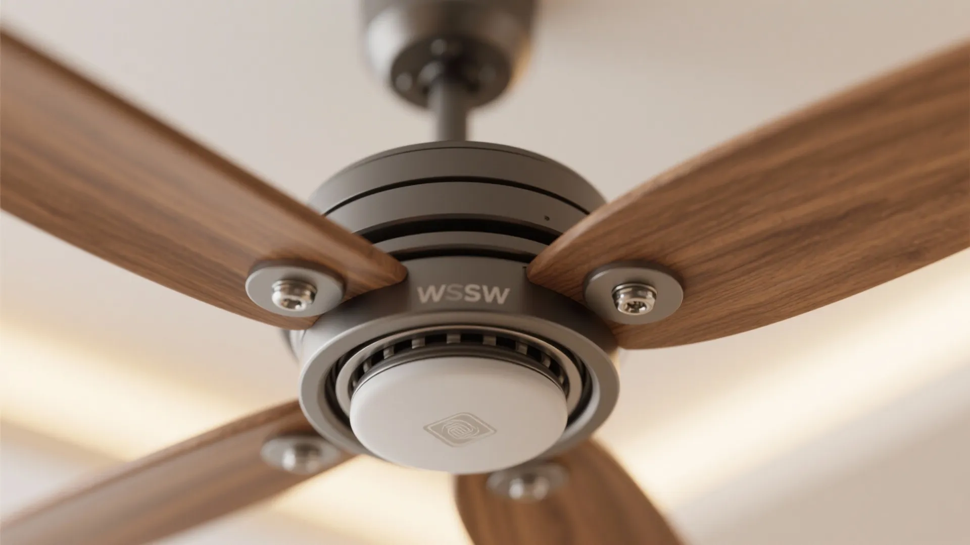 Close up view of a ceiling fan with wooden blades and a white light fixture
