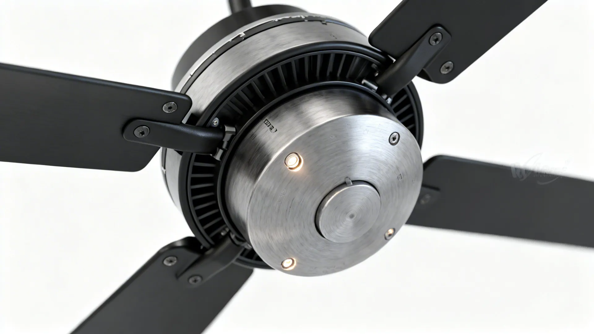 Close-up of a high-quality ceiling fan motor housing and blade attachment showing build detail