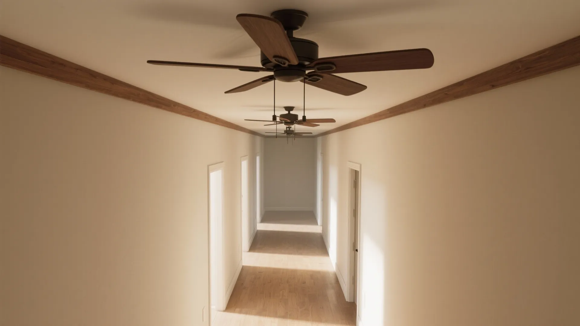 Long hallway with white walls and wood floor featuring three ceiling fans in a row