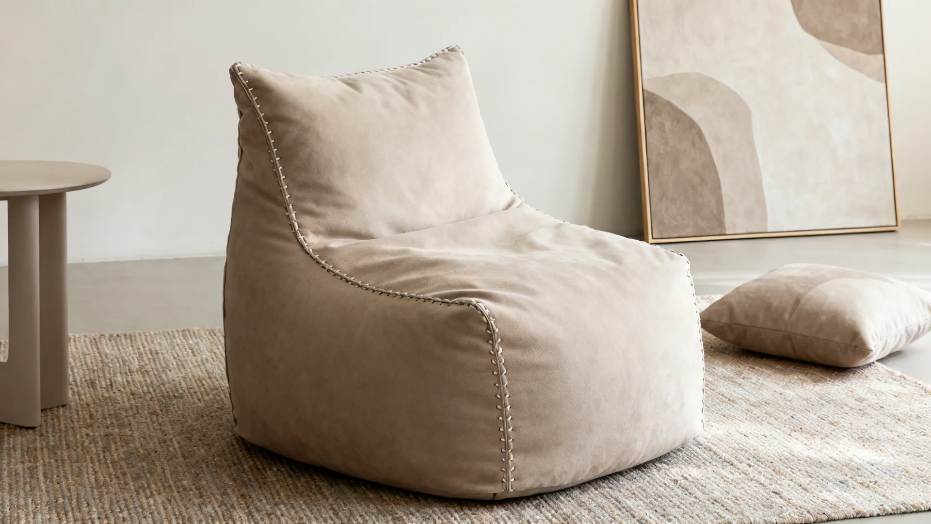 Structured high-back bean bag on a flatweave rug with coordinated accents in a minimalist room.