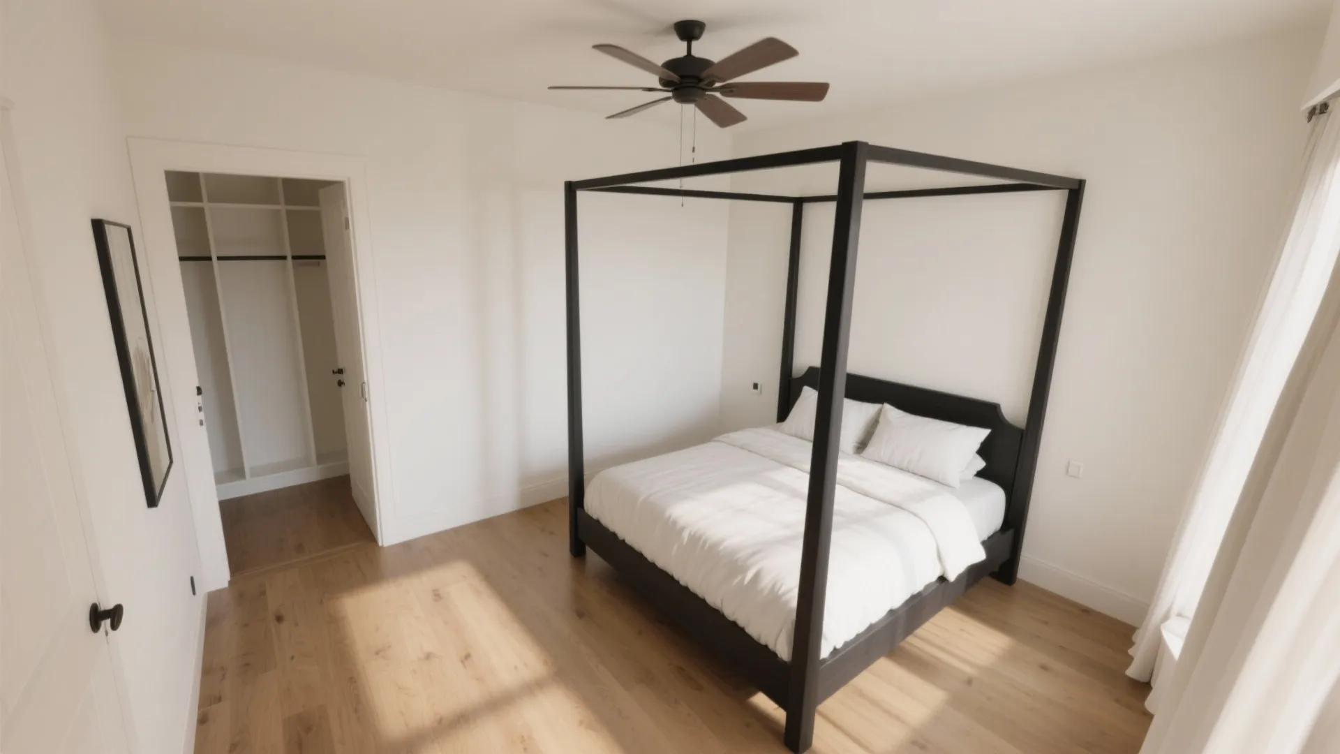 Modern bedroom with black canopy bed wooden floor ceiling fan and open door to closet