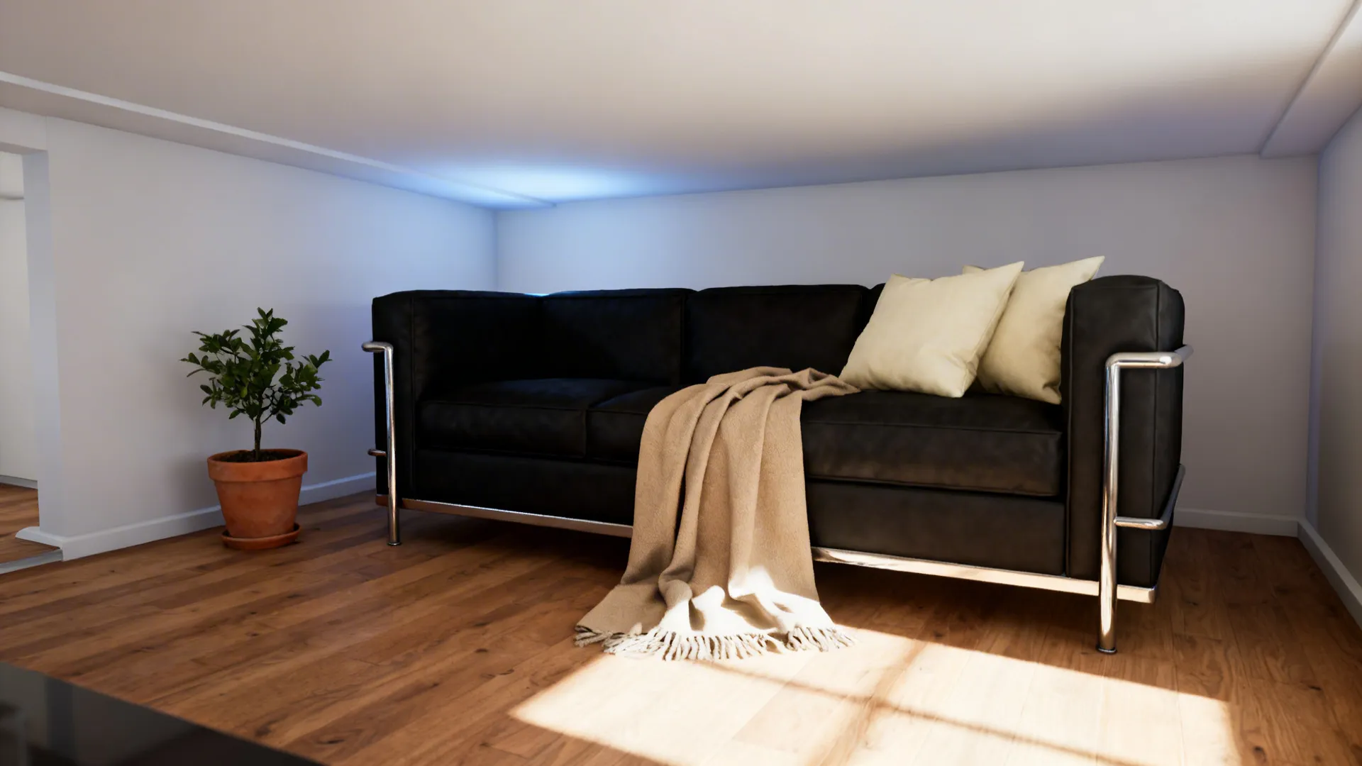 Compact living room showing balanced black, white and silver design with warm accents and plant
