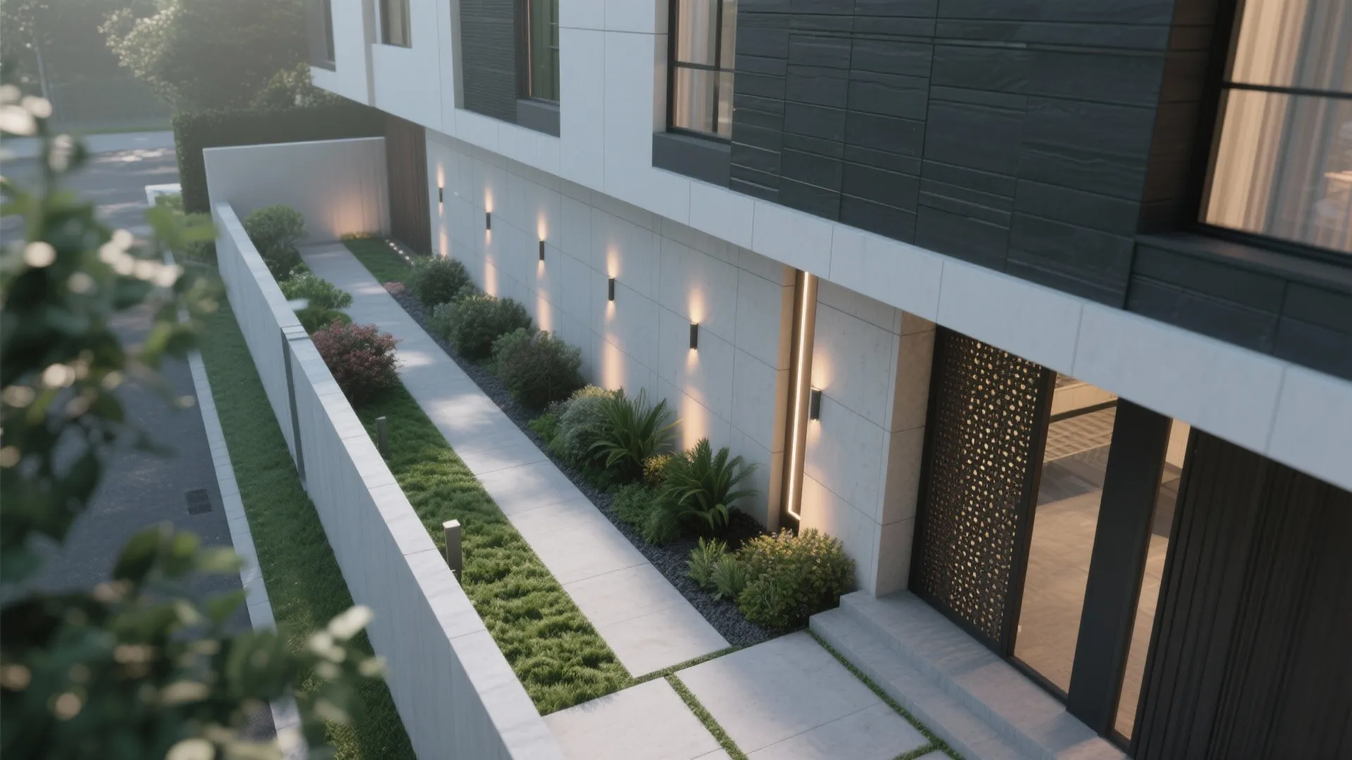 High angle view of a garden walkway next to a modern building with outdoor wall lights
