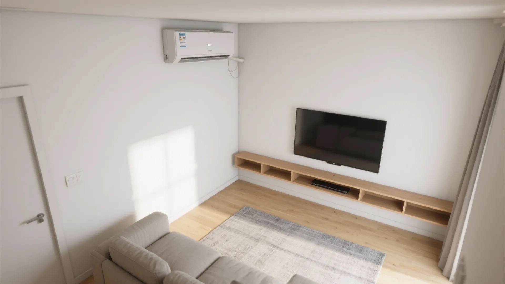 Top view of a living room featuring a television wooden cabinet grey sofa and air conditioner
