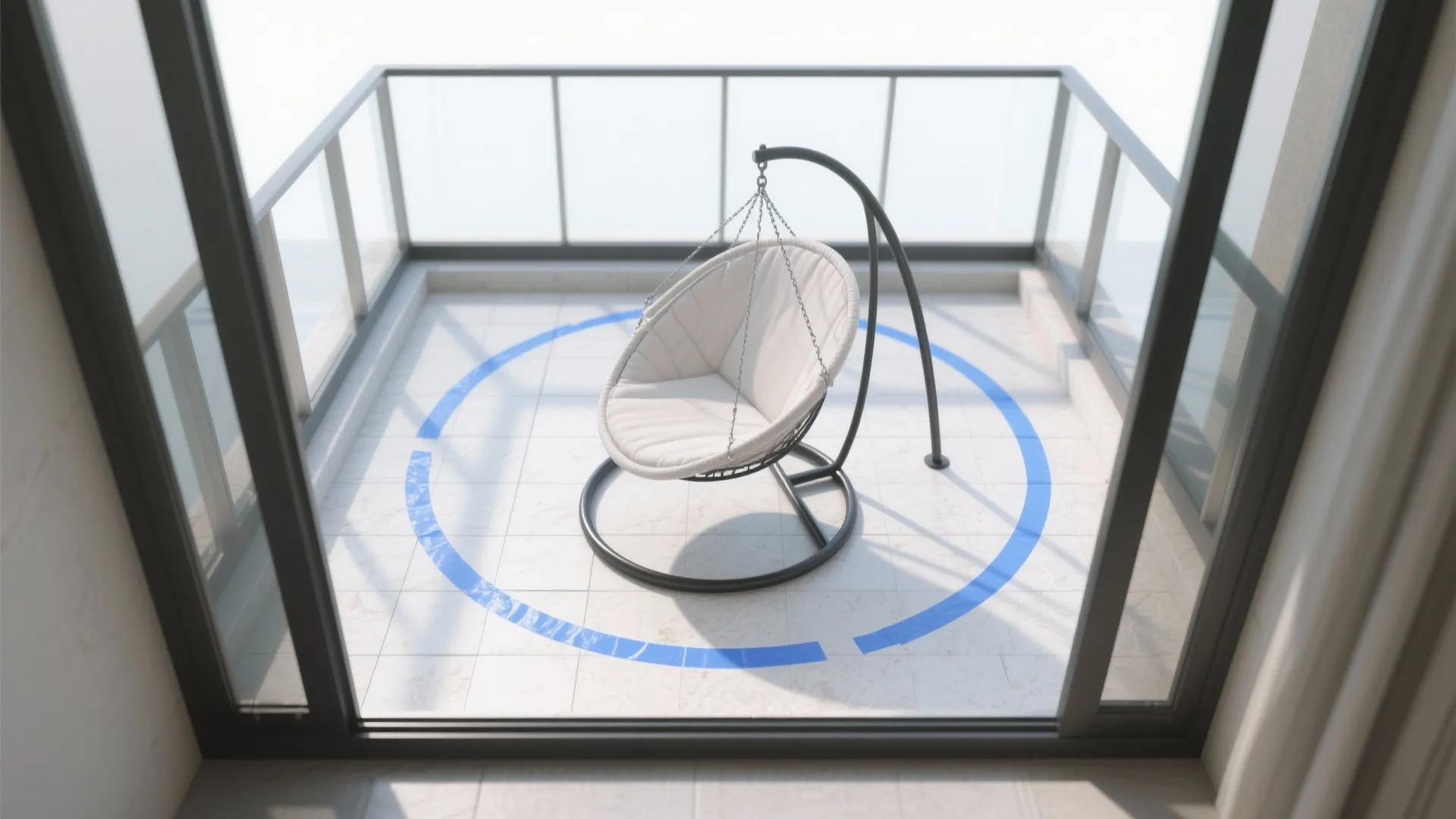 Modern white swing chair on a sunny balcony with glass railings and a blue circle