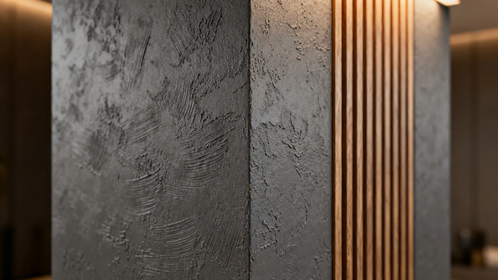 Close-up of a pillar finished with slate-gray Venetian plaster and vertical wood slats, showing tactile texture.