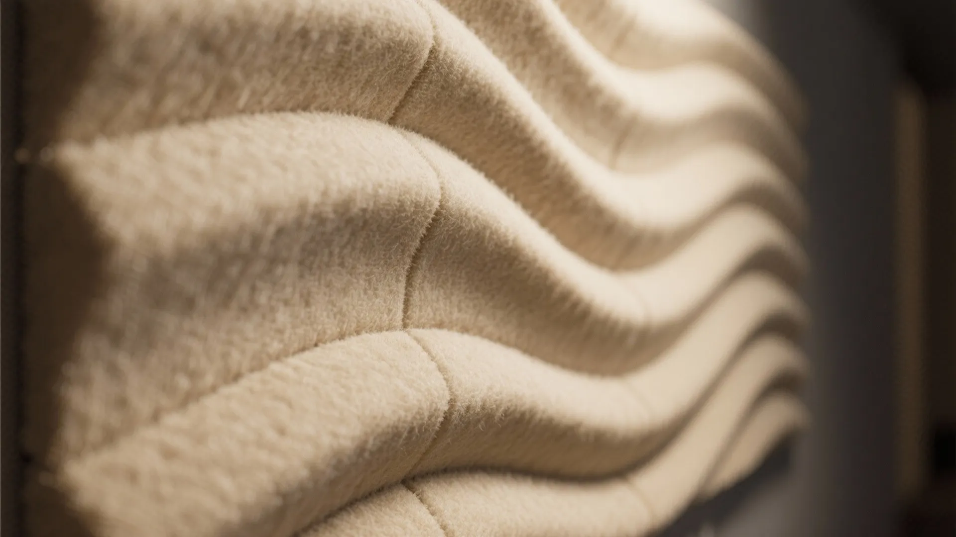 Close up view of soft wavy beige wall panel made of fabric material for decoration