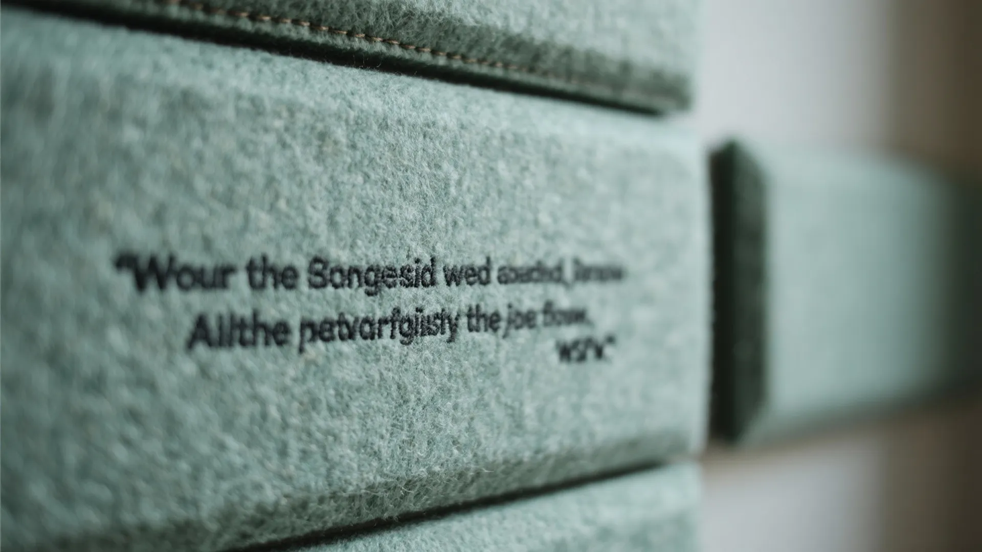 Idea 4: Soft acoustic panels stitched with phrases