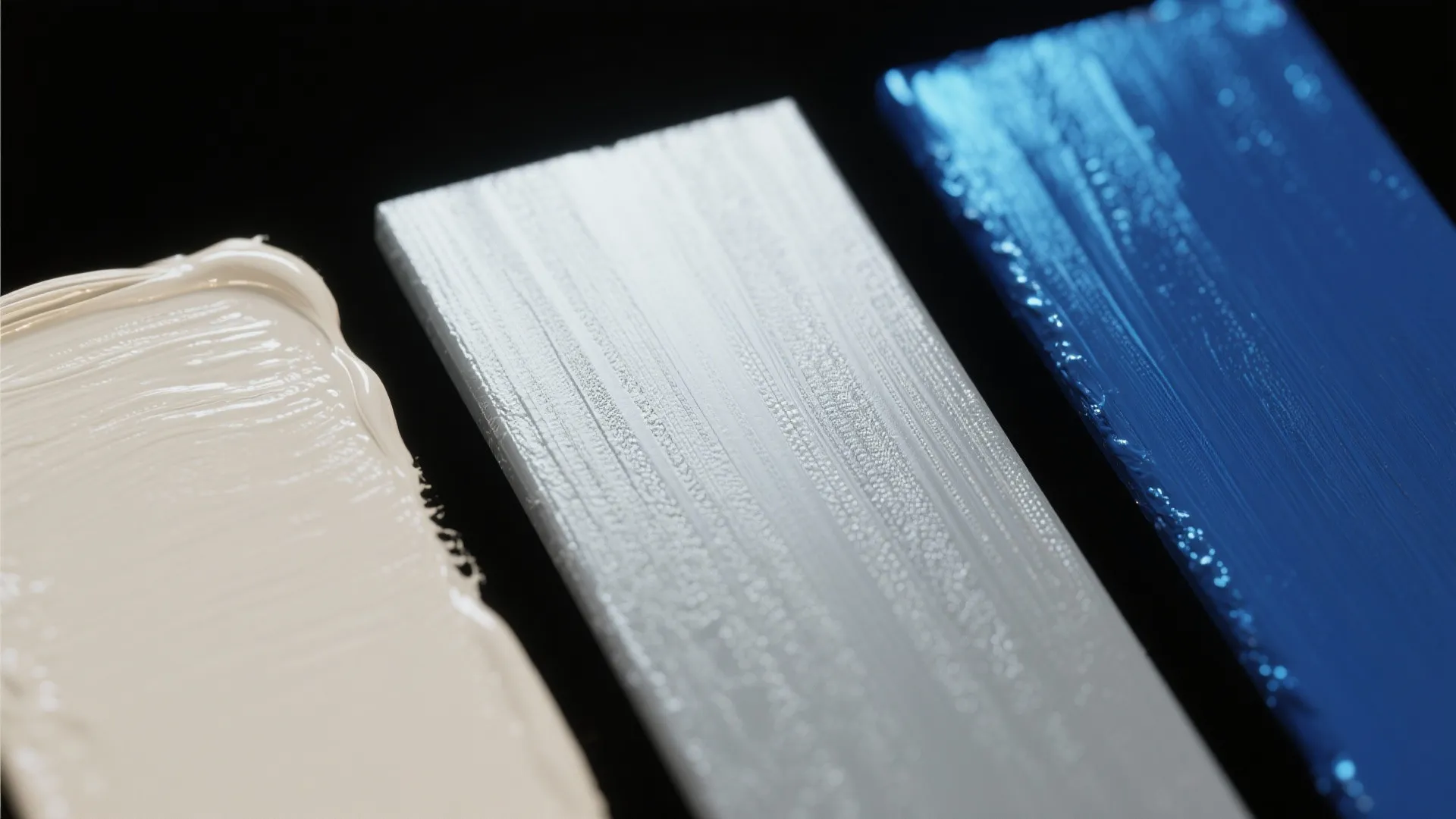 Macro view of eggshell, satin, semi-gloss and metallic paint samples showing sheen and texture differences.