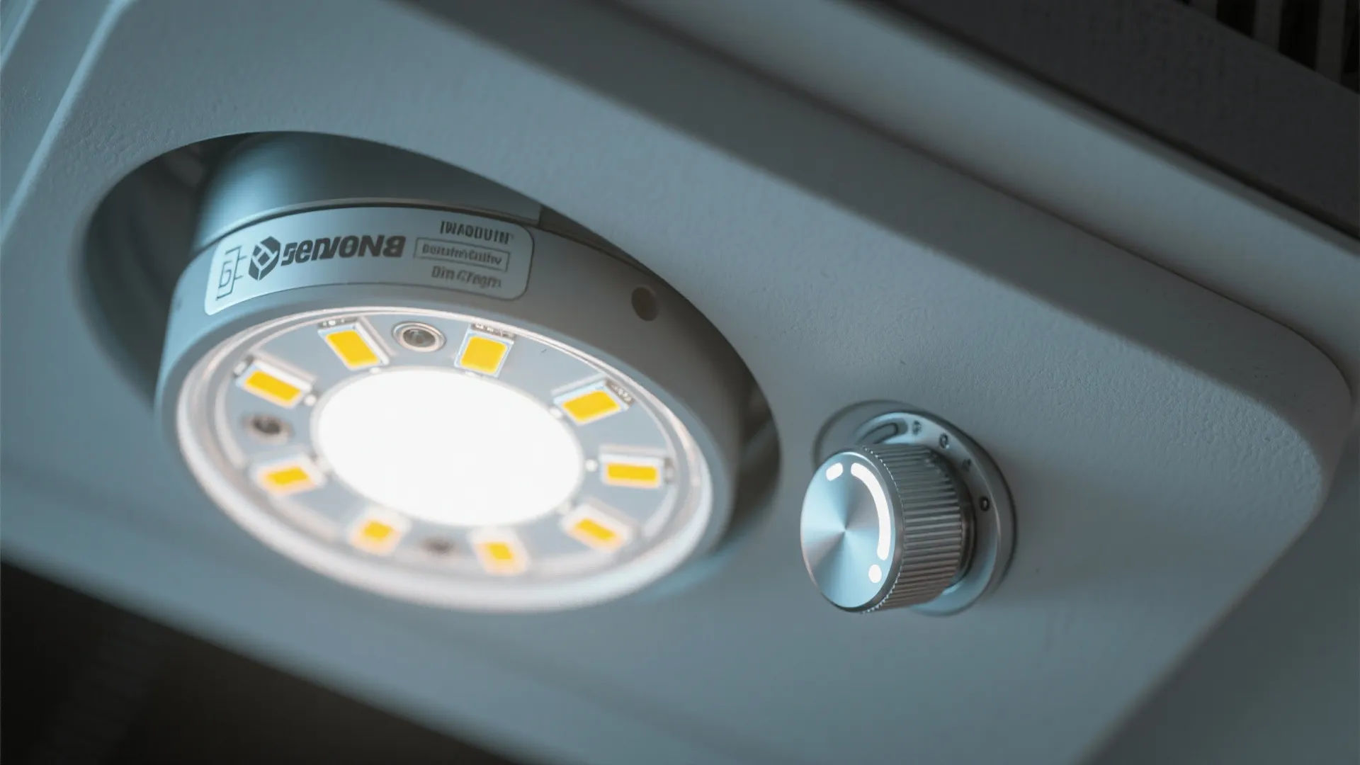 Macro of flush mount LED and dimmer control showing tunable white capability