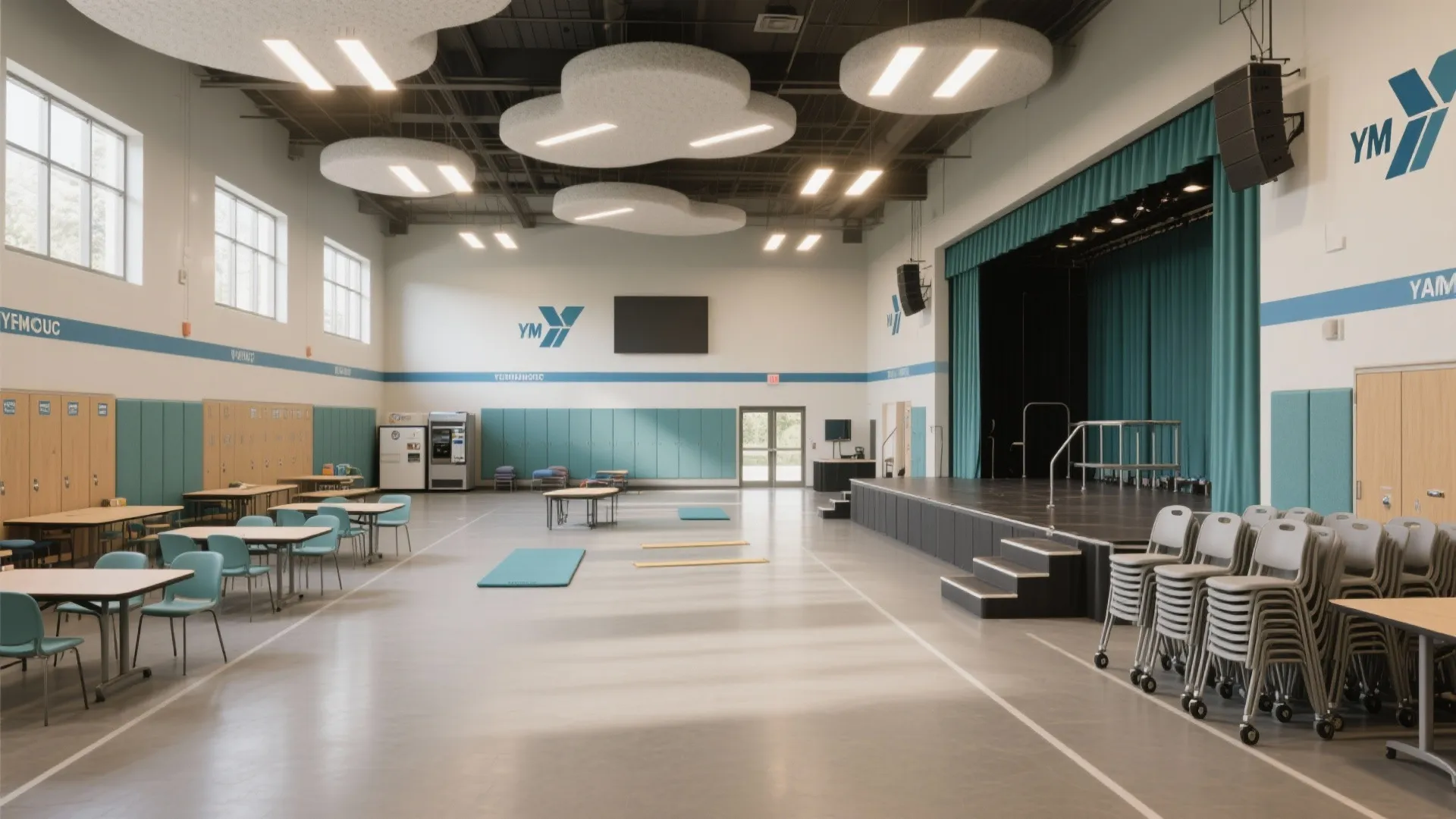 Modern community hall with a stage, wooden floor, stackable chairs, dining tables, and ceiling lights