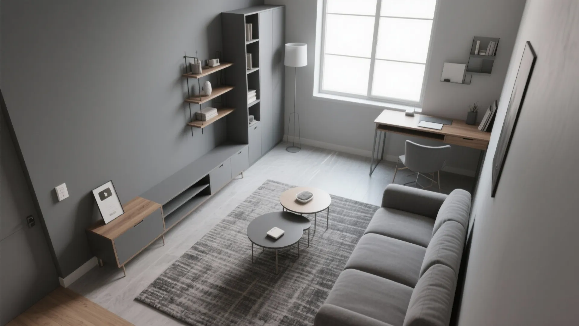 Modern living room layout with grey sofa rug coffee tables desk area and tall storage cabinets