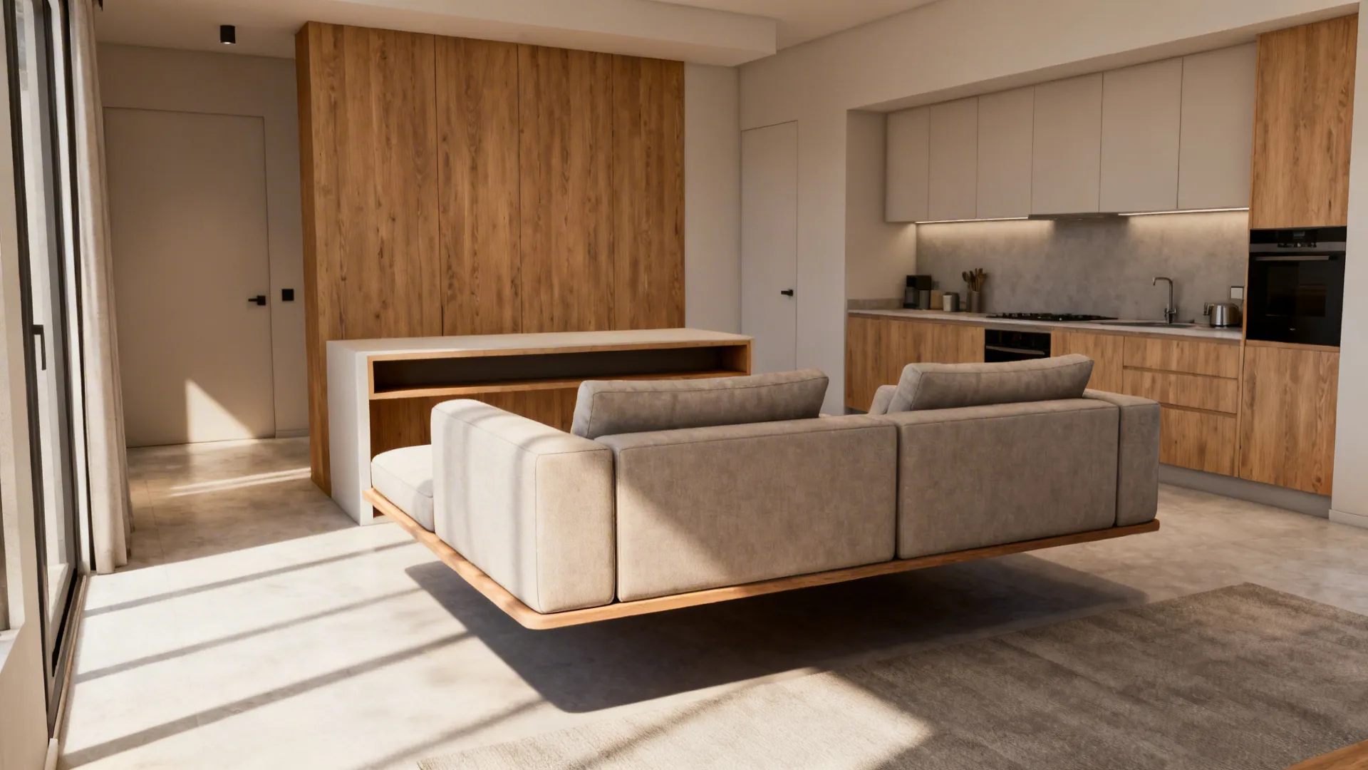 Open-plan apartment with a floated U-shaped sofa creating a distinct seating zone facing a kitchen area.