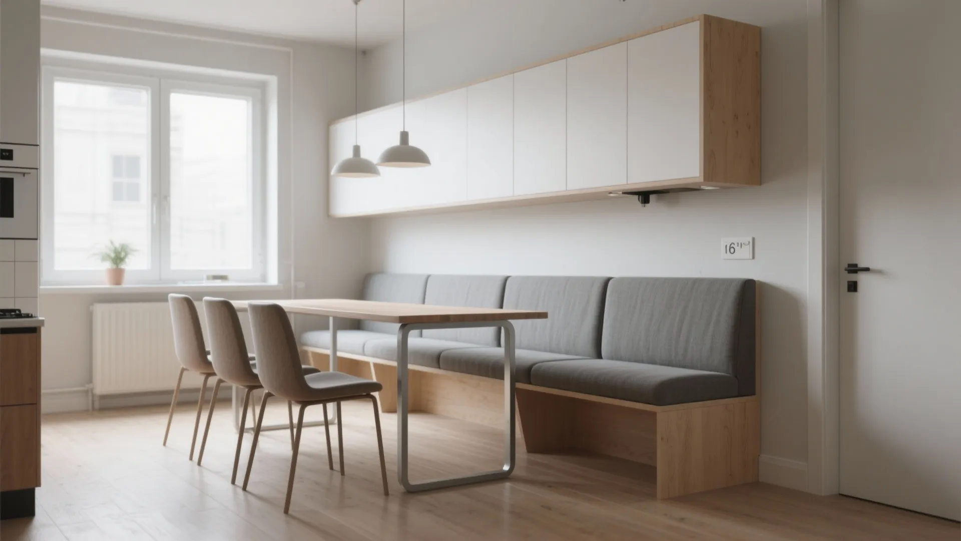 Dining area with wood table grey bench seating white wall cabinets and two white lights