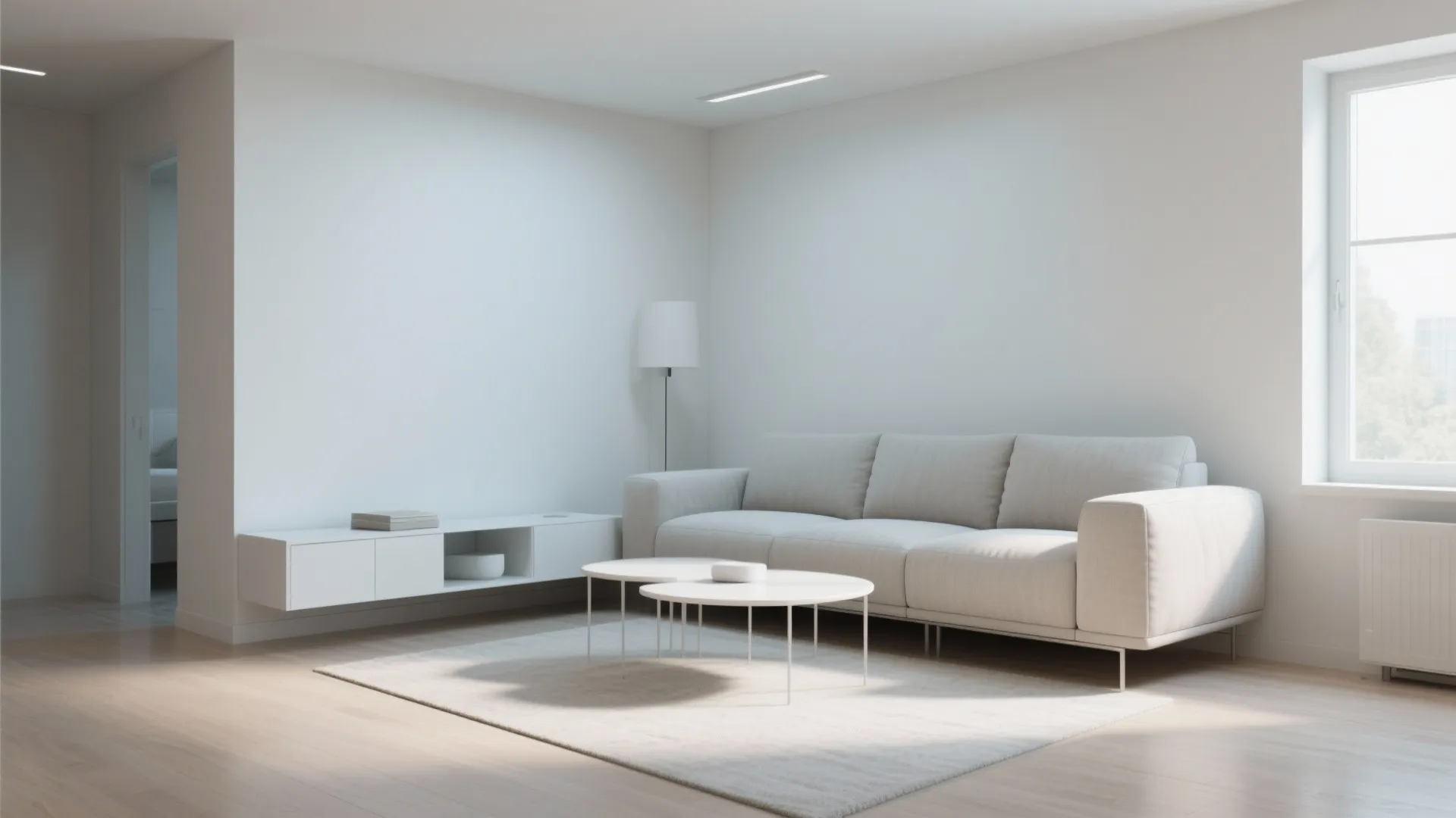 Minimalist white living room with light grey sofa white coffee table and floating wall cabinet