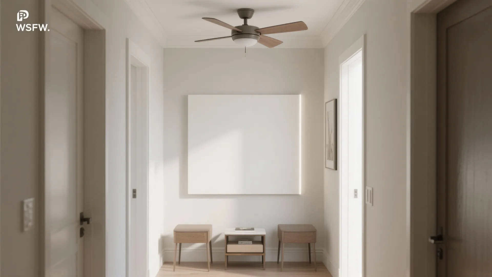White hallway featuring a ceiling fan, large blank wall panel, and two small wooden footrests