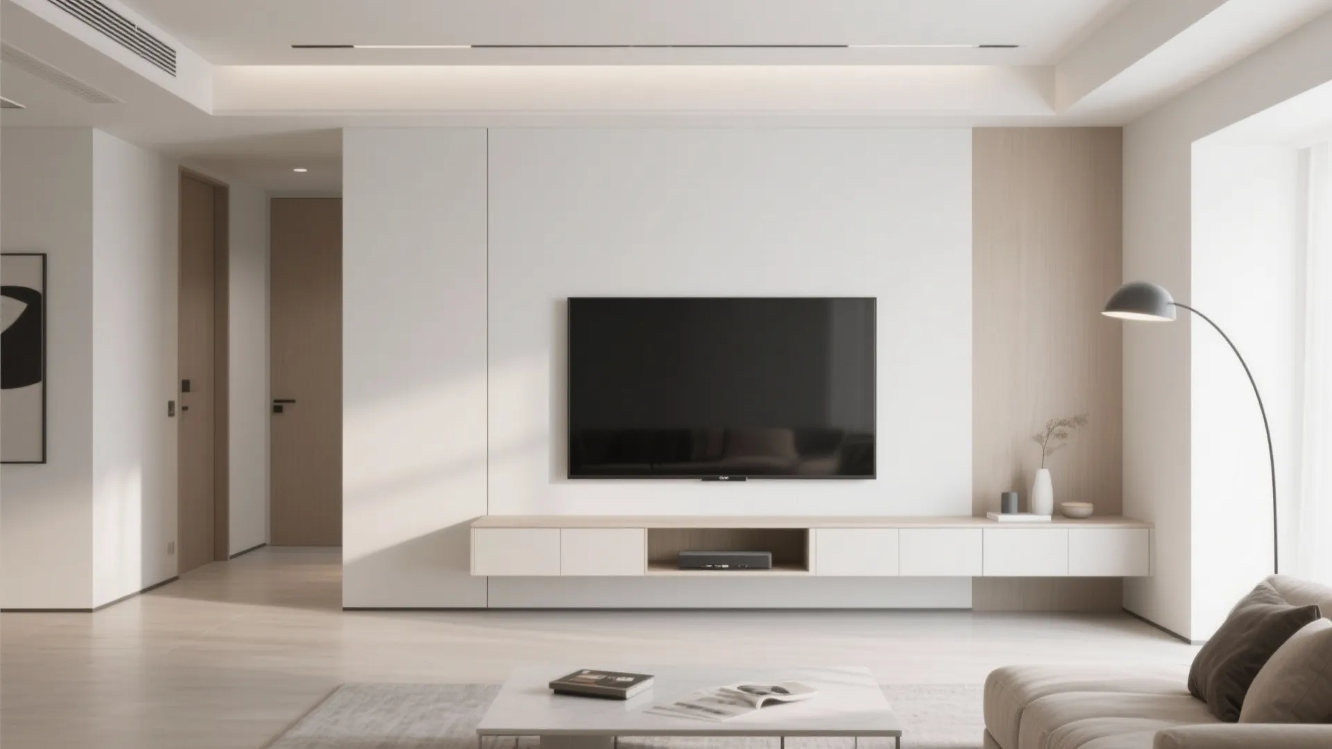 Modern minimalist living room featuring a white floating cabinet under a large wall mounted television
