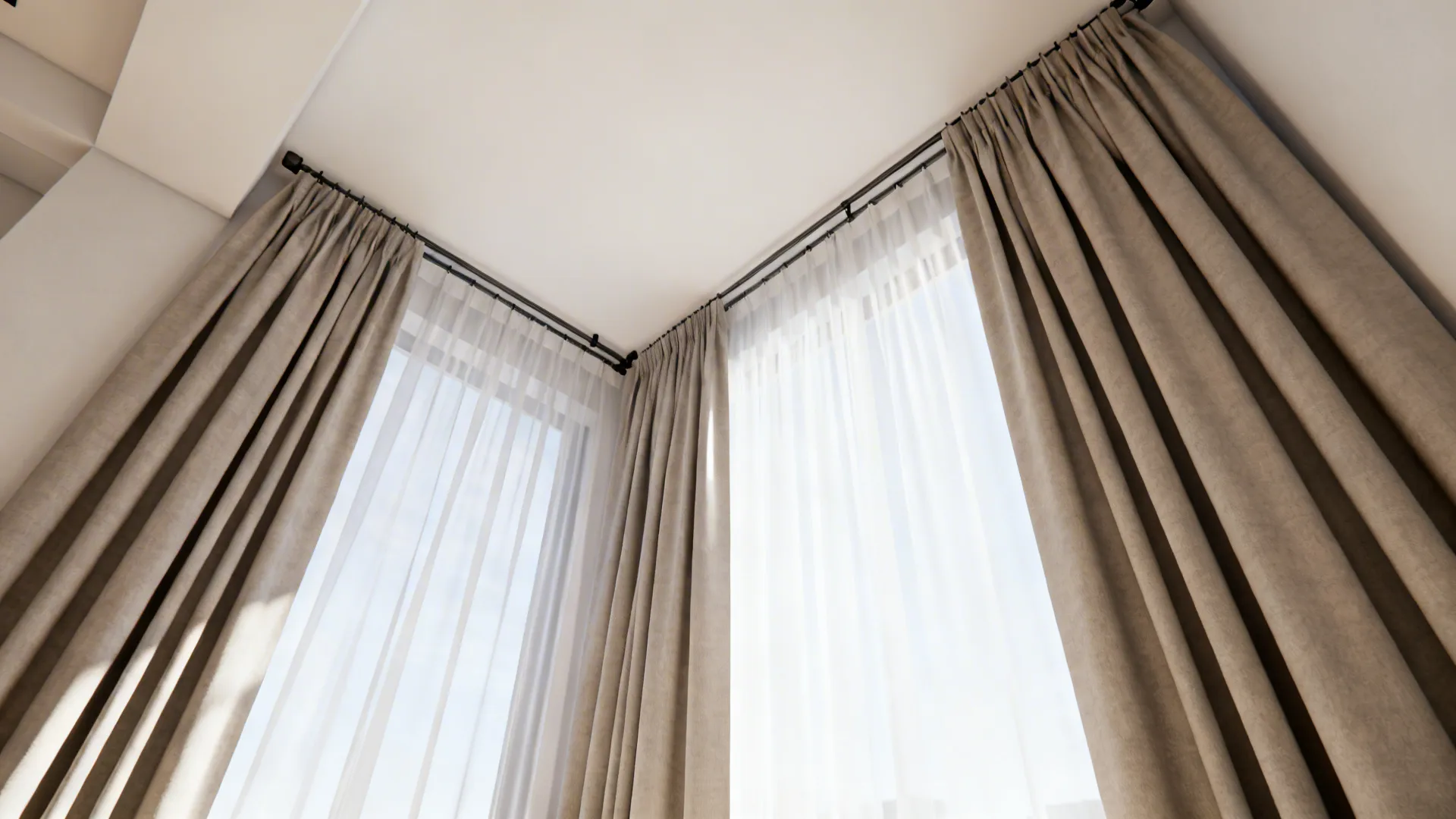 Ceiling-mounted tracks with three panels hung floor-to-ceiling to visually raise a small room's height.