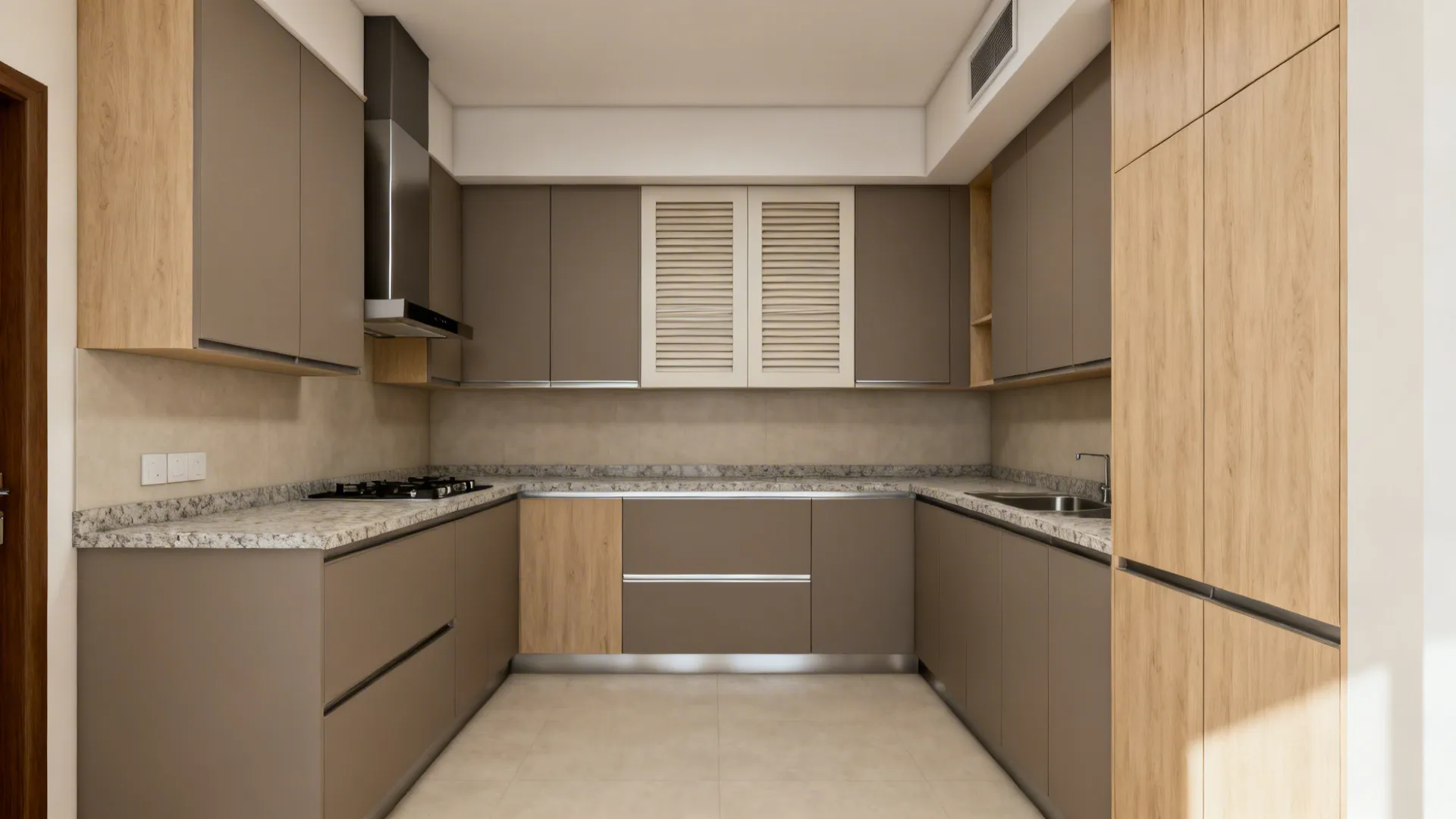Flush-mounted chimney hidden in cabinetry with seamless panels in a compact Indian kitchen.