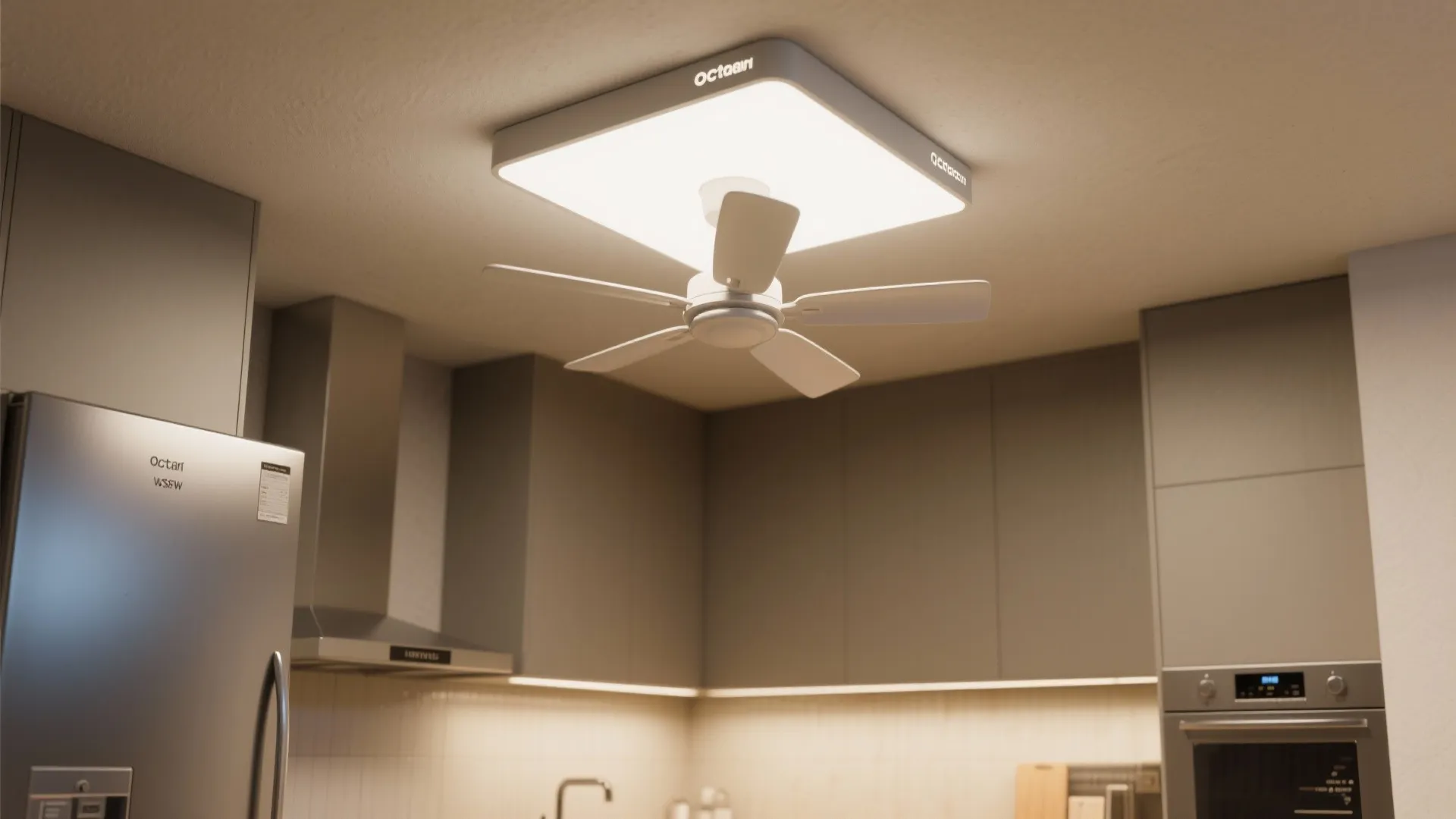Modern kitchen with white ceiling light fan installed above grey cabinets and stainless steel appliances