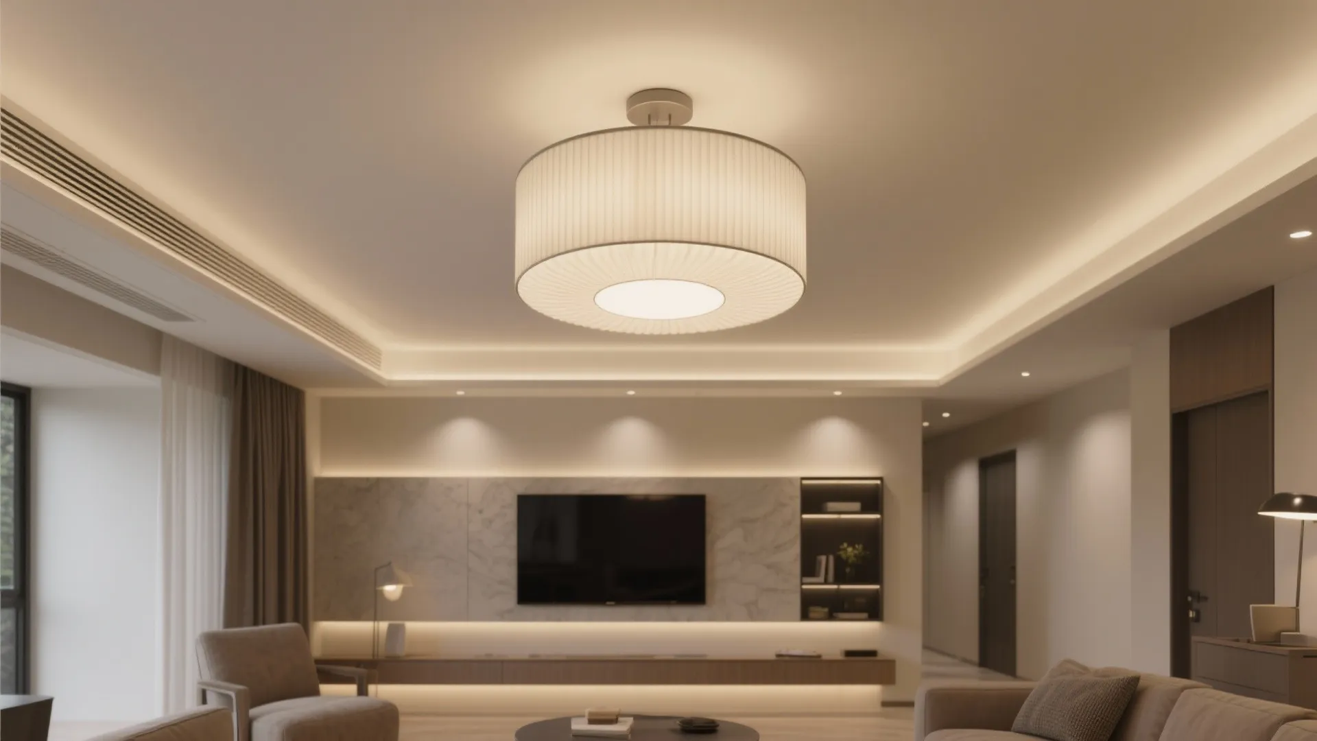 Modern flush-mount drum chandelier softly lighting a low-ceiling living room.