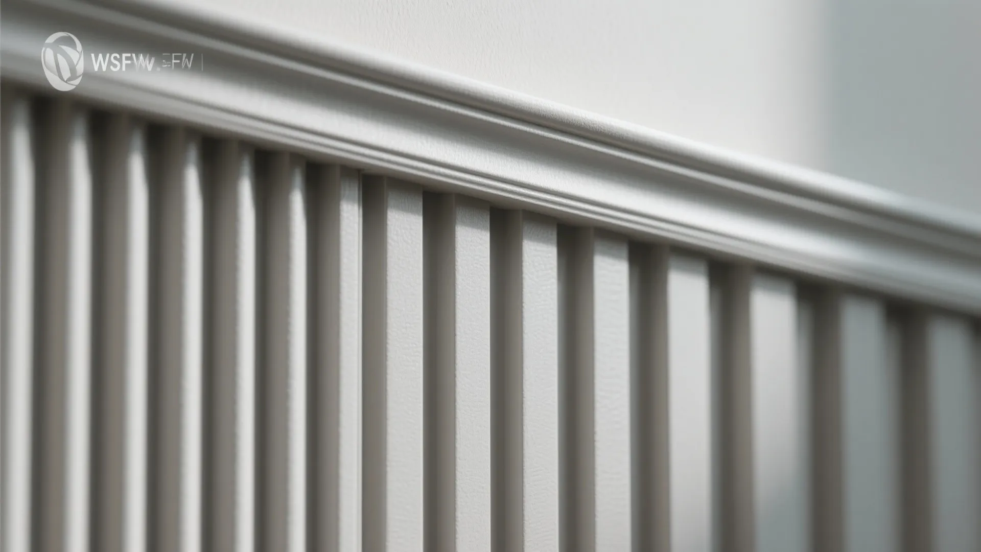 Close up view of white wall panel design with vertical wood slats and decorative trim