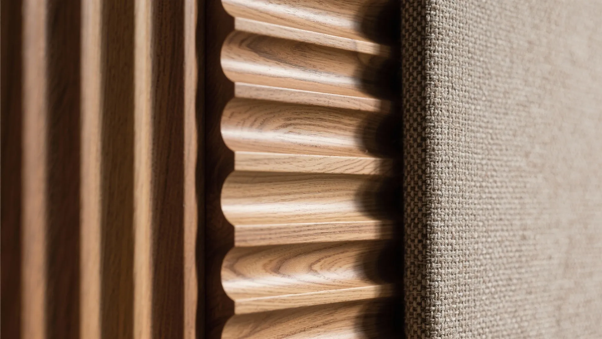 Textured backdrop: fluted wood or fabric acoustic panels