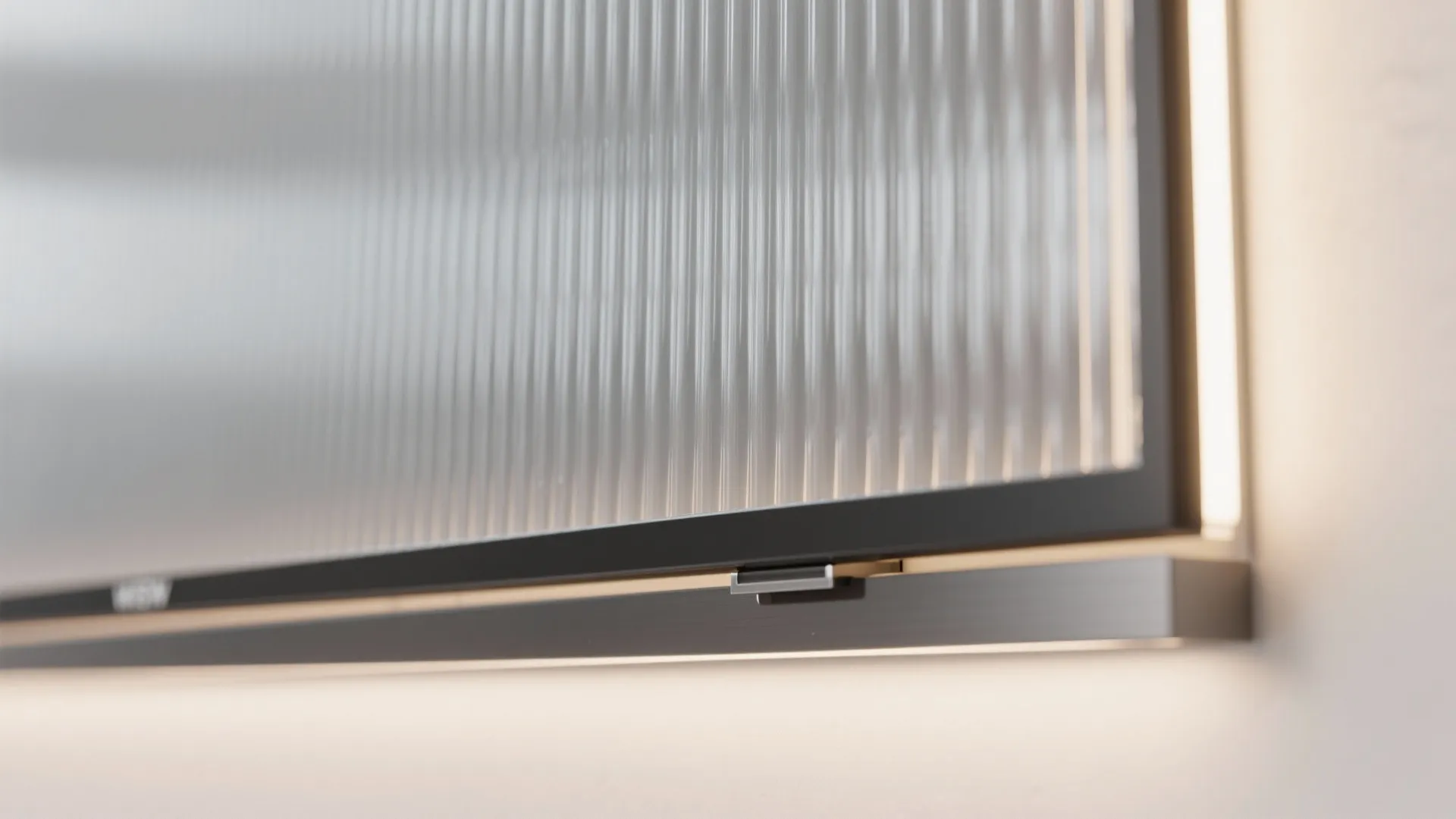 Glass backsplash behind the TV for light and depth