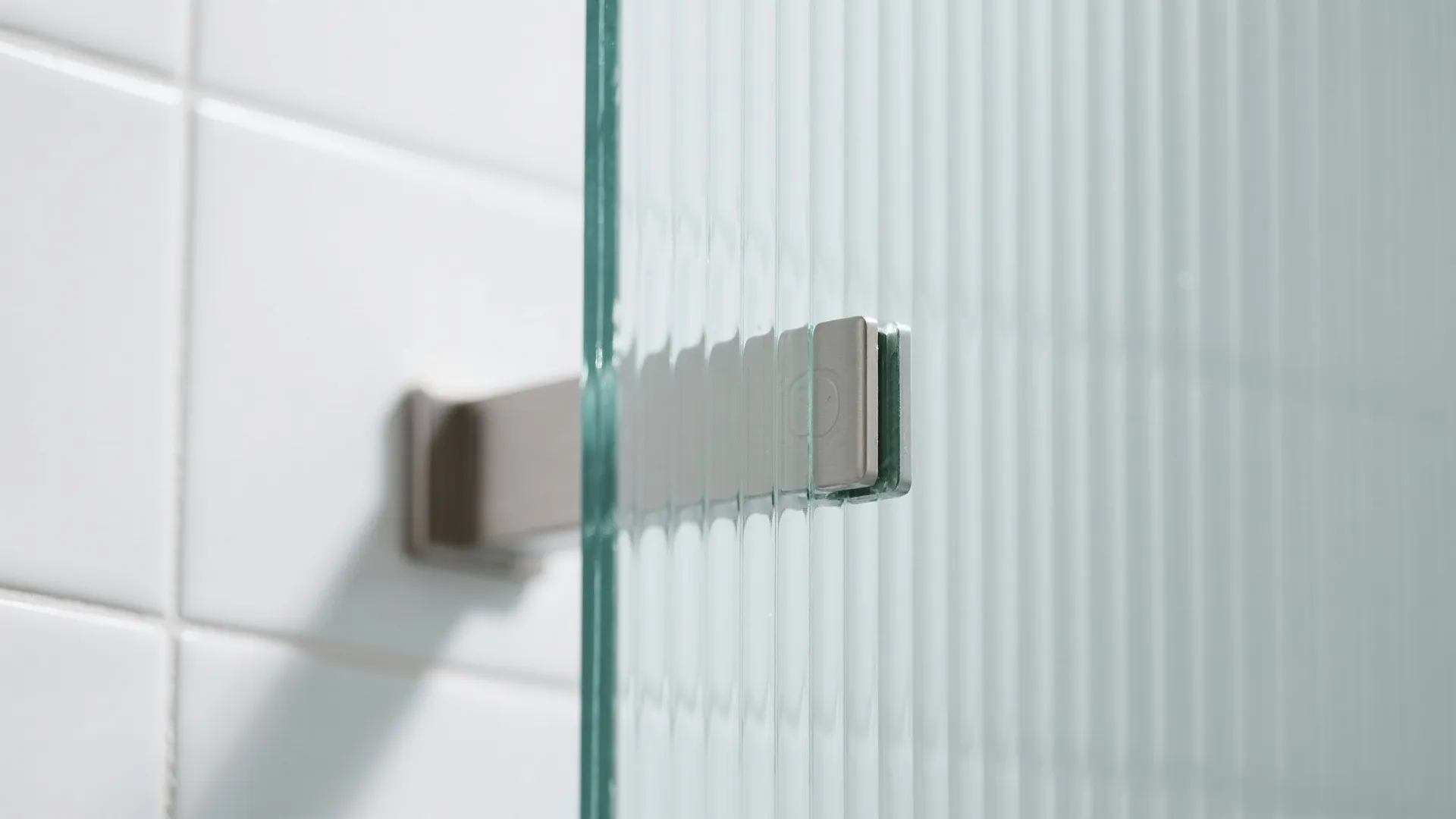 2) Glass partition shower with fluted privacy panels