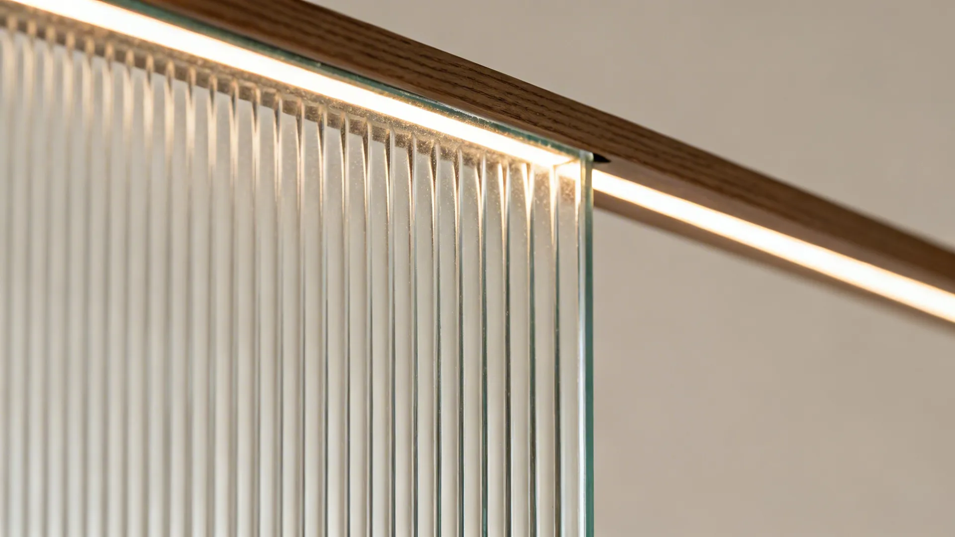 Macro of ribbed fluted glass with defined vertical grooves and soft light.