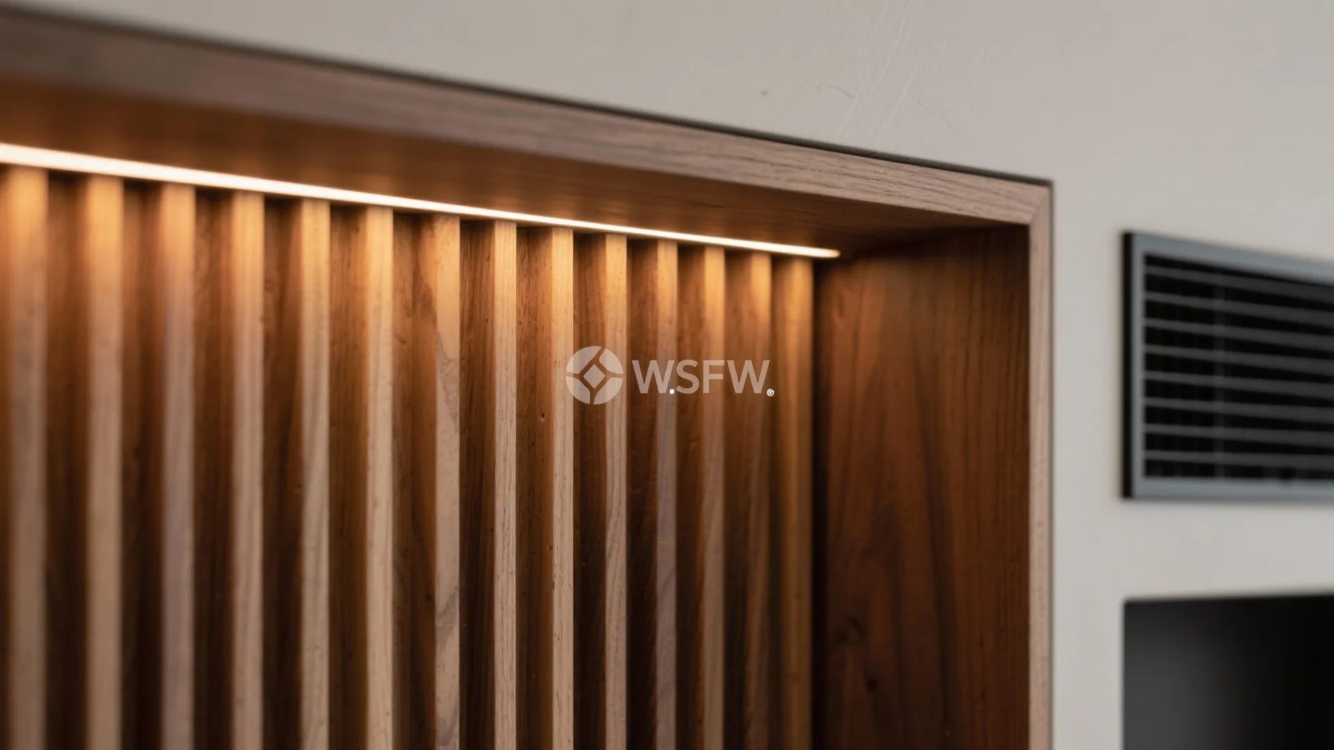 Built-in media wall with fluted panels and niche lighting