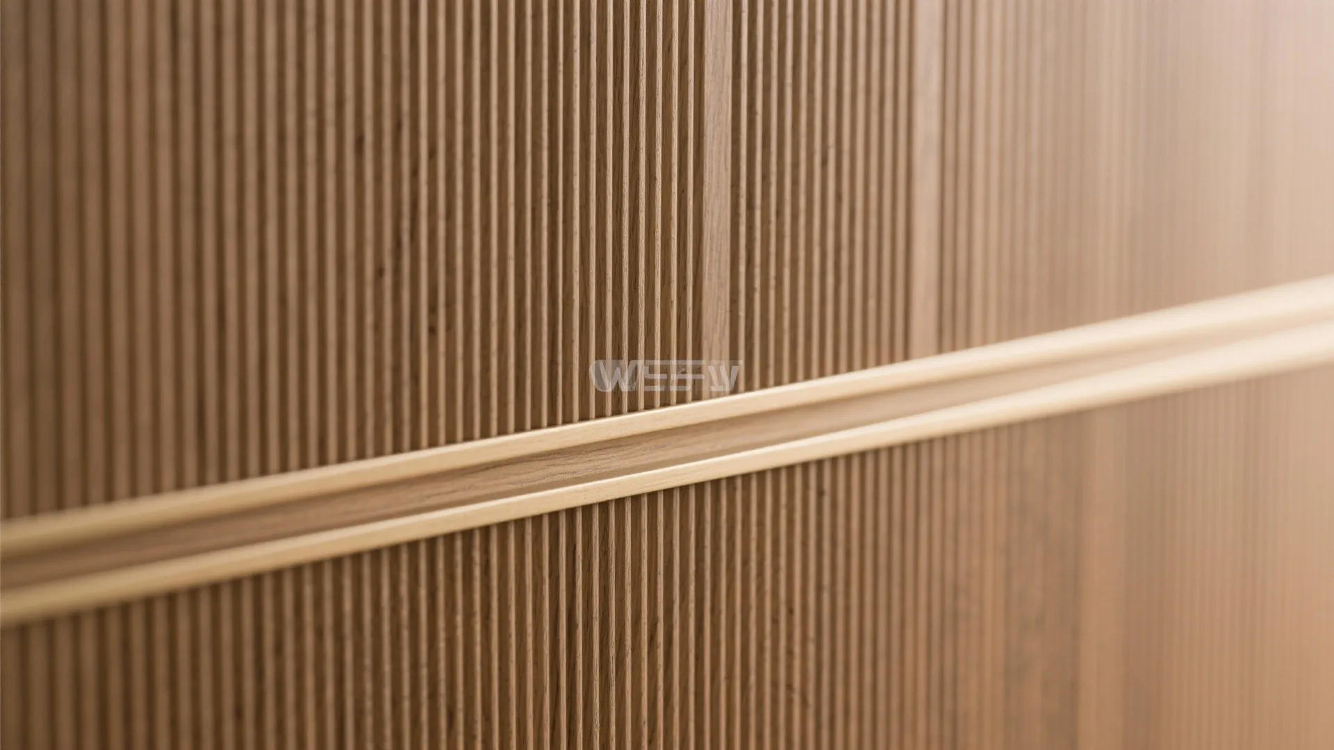 Close up view of vertical wooden wall panel textures with a horizontal gold metal trim detail