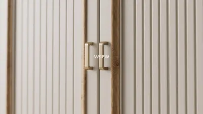 Modern Cabinet Design with Wood Accent and Gold Handles