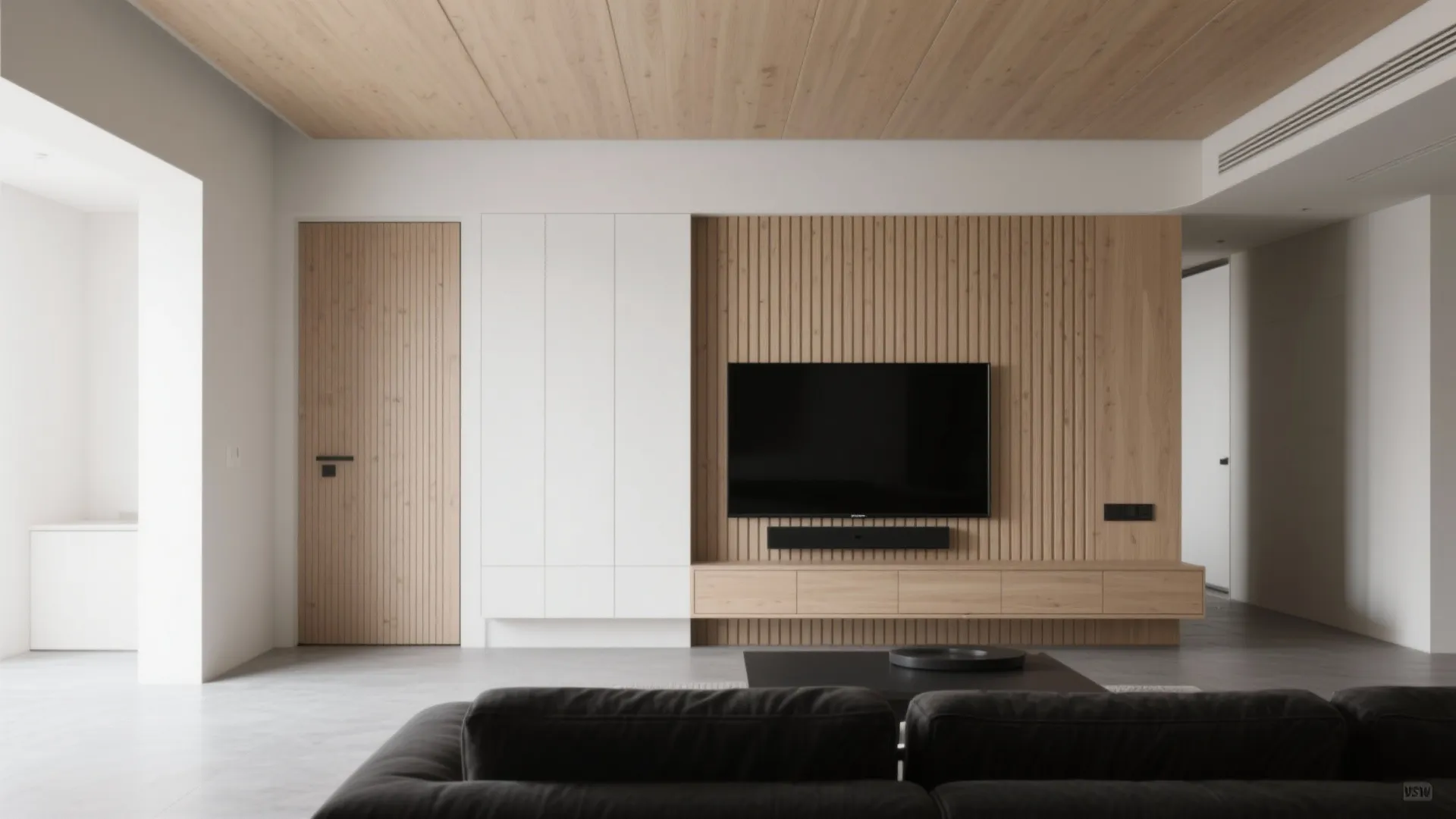 Modern living room featuring wood wall panel behind television with white cabinet and grey sofa